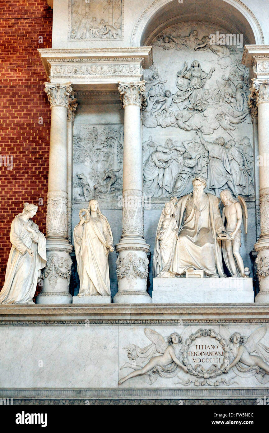 Titian monument, in the church of the Frari, the Basilica di Santa Maria Gloriosa dei Frari, Venice, church built 1338. Tiziano Vecelli or Tiziano Vecellio (c. 1488/1490 - 27 August 1576) better known as Titian, Italian painter, the most important member of the 16th-century Venetian school. Erected in 1852 by Ferdinand L, (1838-52, ) with muses: Sculpture, Architecture, Painting, Wood-carving. Titian himself is seated in the centre ; behind him is a relief representing his famous picture of the Assumption (the High Altar-piece of this Franciscan church) and altar. A winged Venetian lion is on Stock Photo