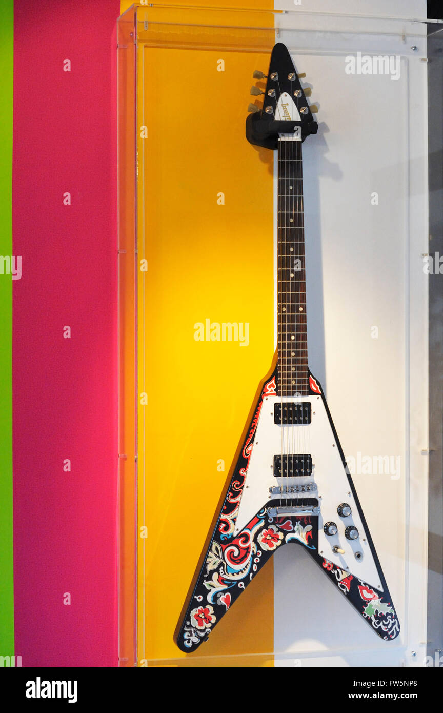 Jimi Hendrix memorabilia: Gibson Flying-V electric guitar, Cumberland Hotel, suite 507-8, now 5001, Great Cumberland Place, W1, the Jimi Hendrix Suite where he lived for 5 weeks after his last-ever British concert and before his final interview and death. To mark the 40th anniversary of his death, designers Mary Gannon and Cynthia Garcia have fashioned a contemporary version of the psychedelic Sixties. Jimi owned a Flying V that he'd painted psychedelic designs on: the Flying V used at the Isle of Wight was a unique custom left-handed guitar, whereas this guitar on dsplay is strung normally... Stock Photo