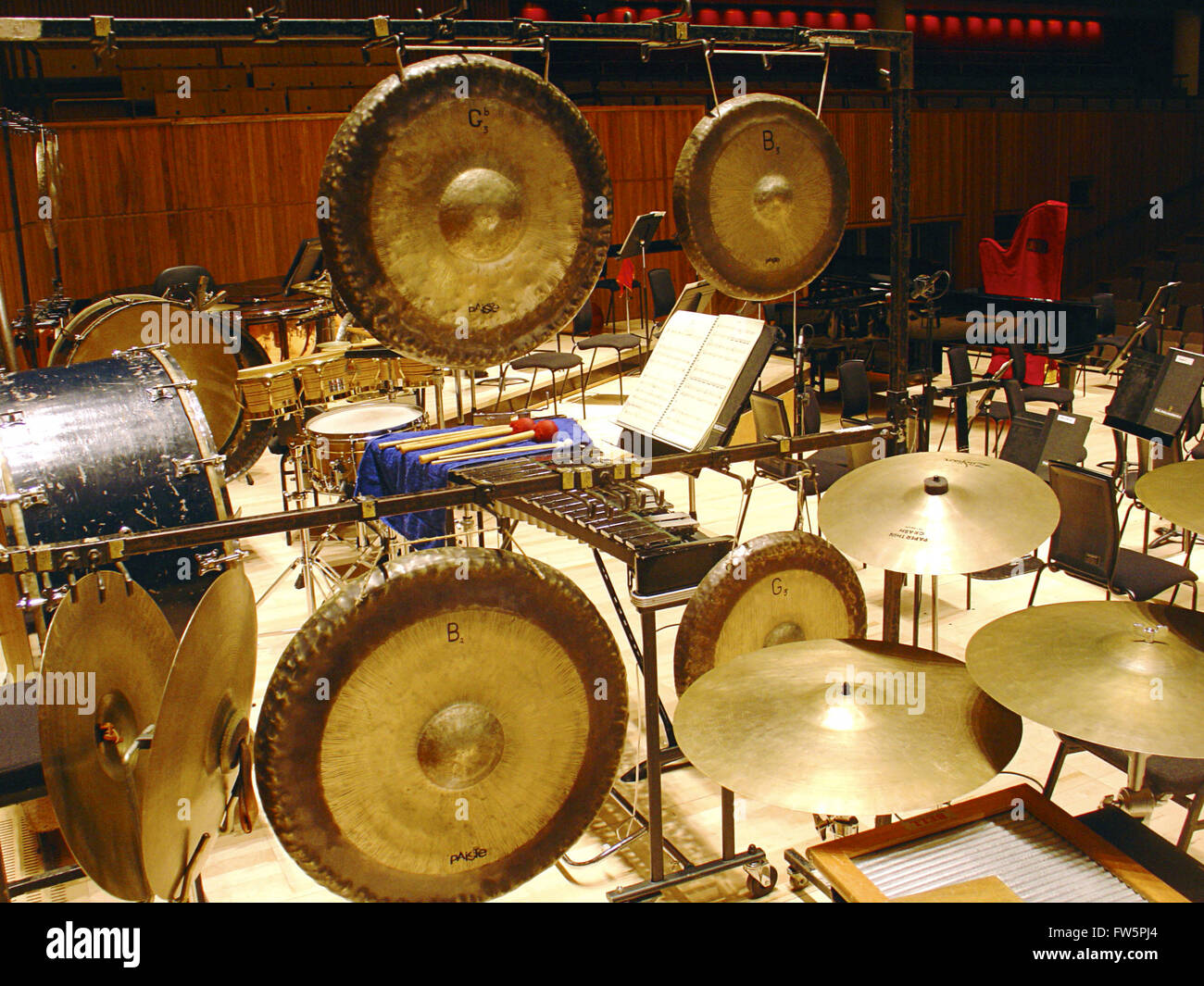 Gongs, bass drum and cymbals, orchestral percussion intruments arranged on  concert platform Stock Photo - Alamy