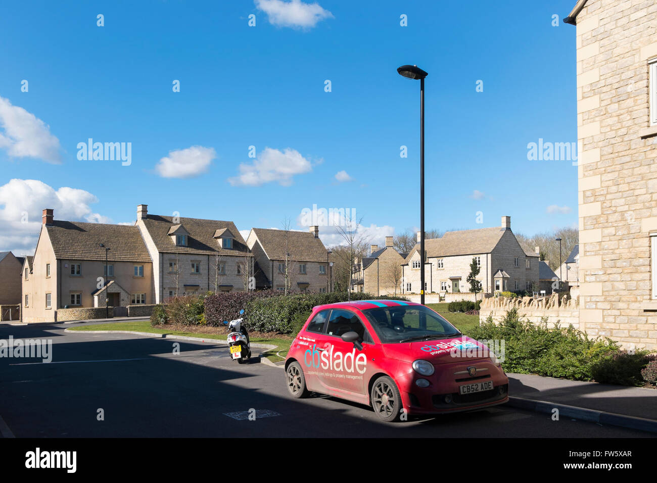 Estate agent's Fiat 500 car at a new housing development on the