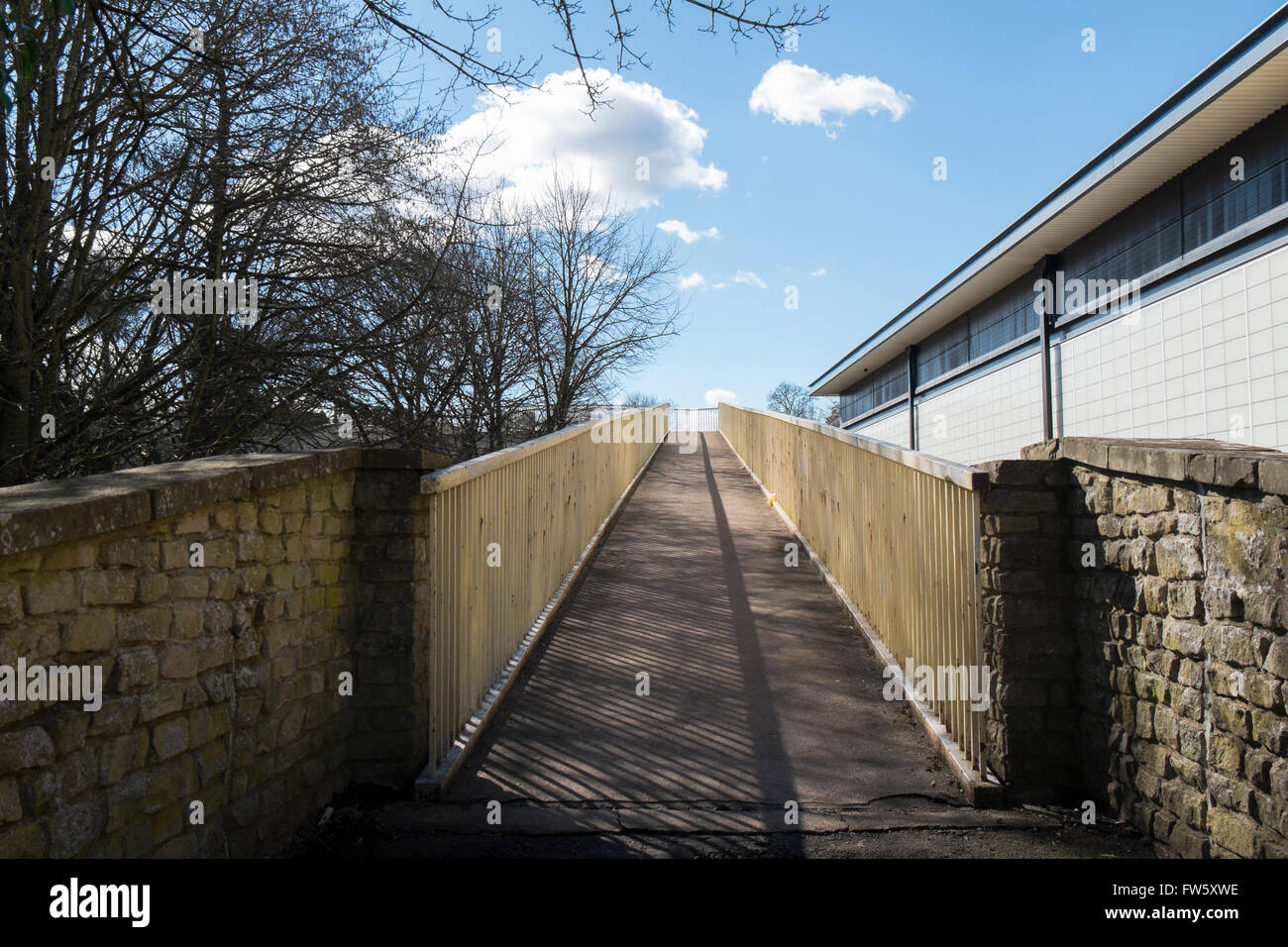 Footbridge over the A429 leading to the hospital in Cirencester, Gloucestershire, UK Stock Photo