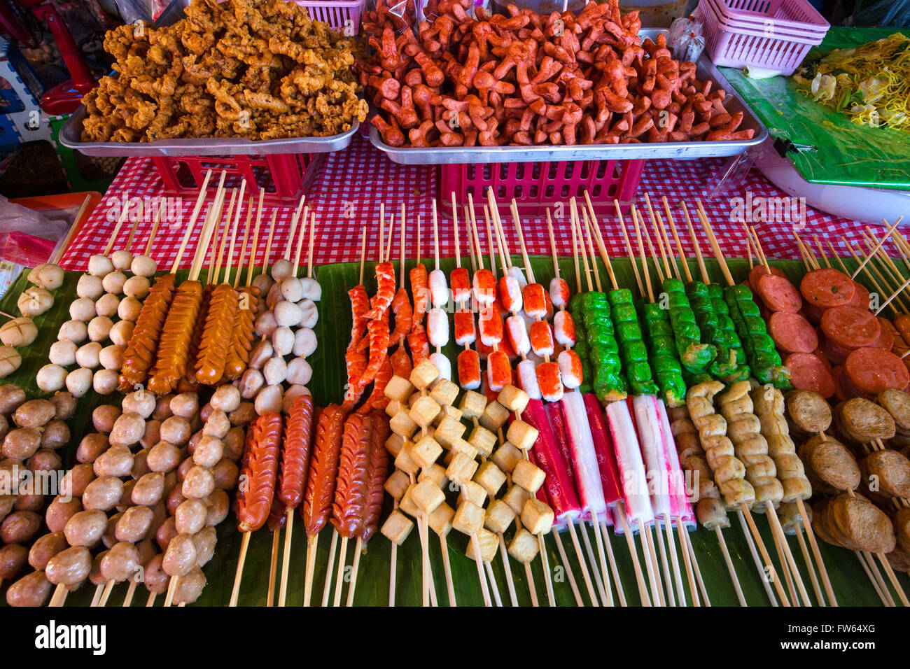 Market stall with various skewers with meat, fish and sausage, food