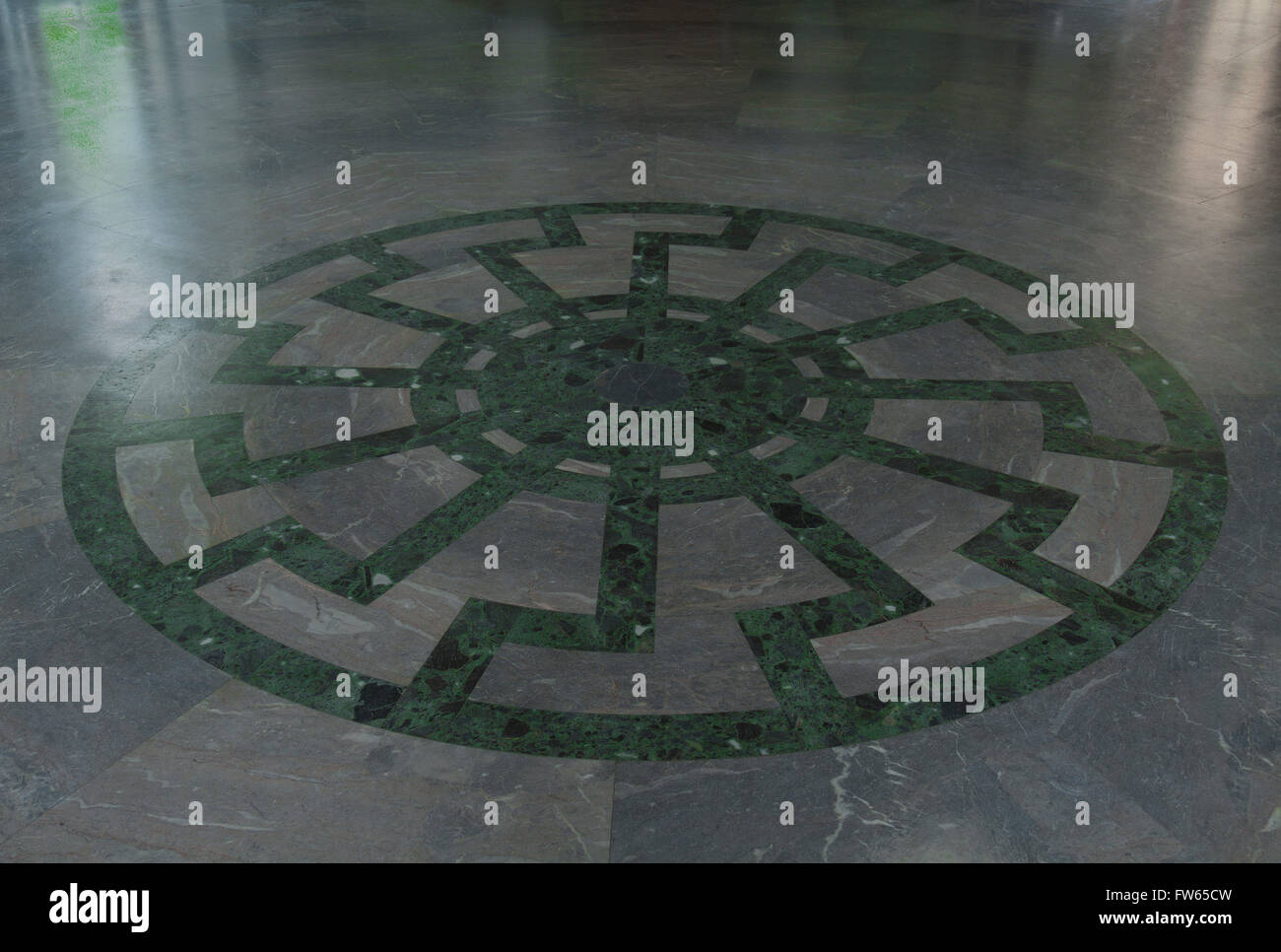 Ornament of the Black Sun wheel mosaic with superimposed swastikas in the floor of Obergruppenführersaal, SS Generals' Hall, Stock Photo