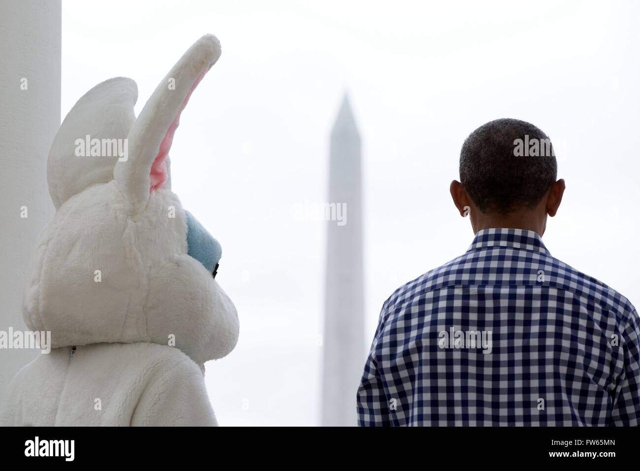 U.S President Barack Obama and the Easter Bunny listen to the First Lady delivers remarks from