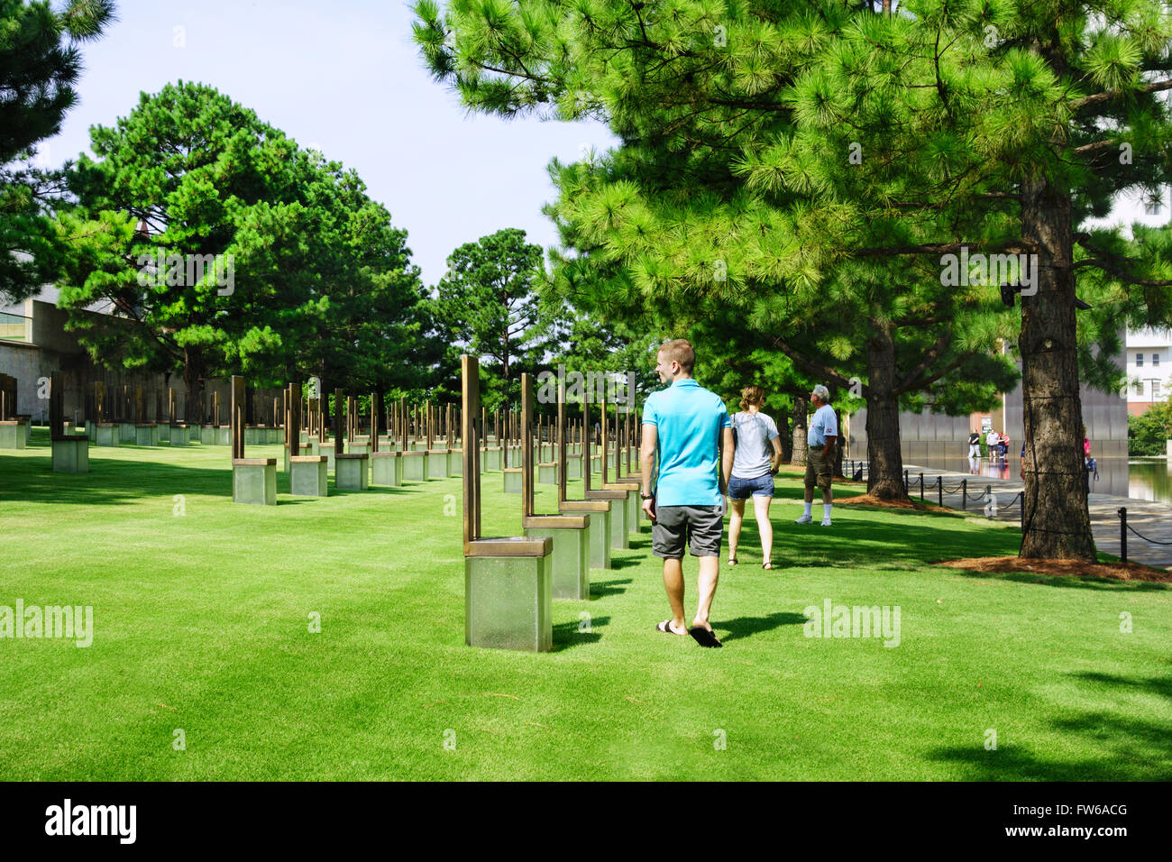 Vistors walk the grounds of the Field of Chairs honoring victims of the Oklahoma City bombing. USA. Stock Photo