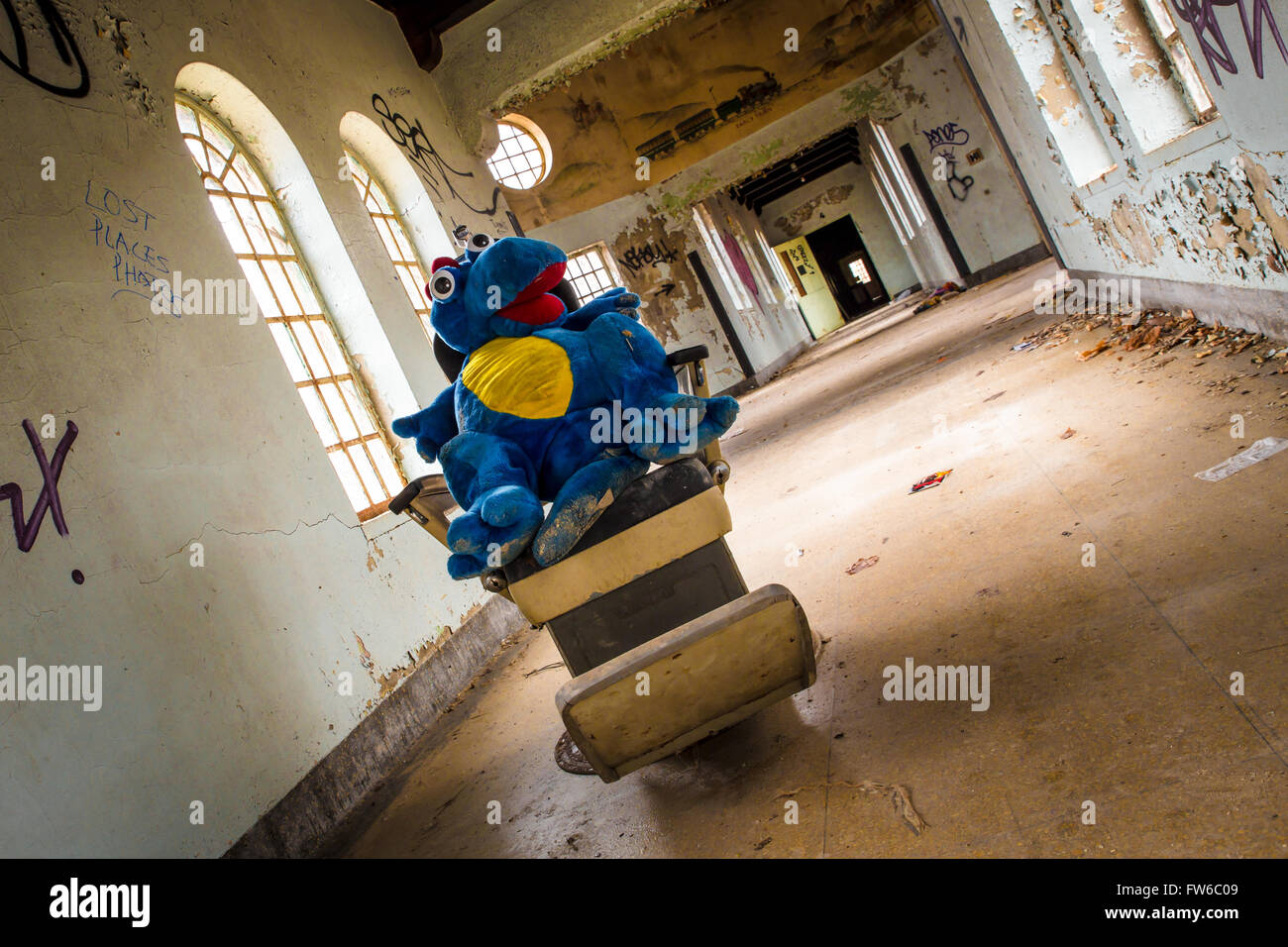 Orangeburg, New York, USA - February 17, 2016: Eerie scene with cart full of toys  inside abandoned children's ward at Rockland Stock Photo