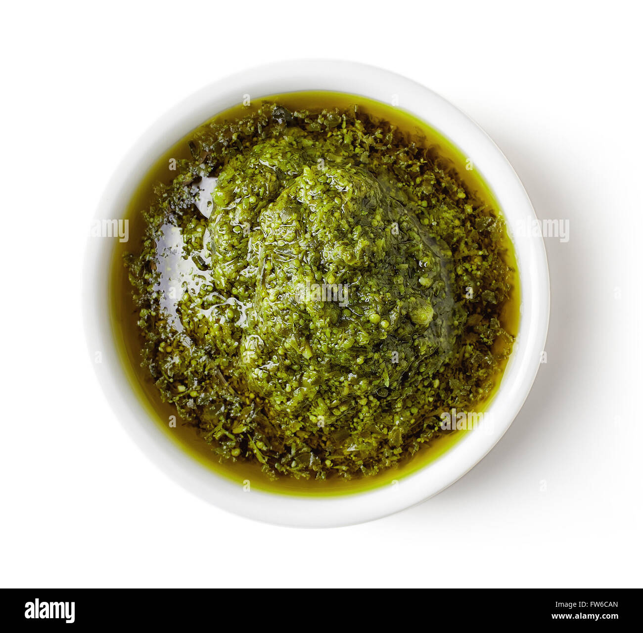 Green pesto sauce isolated on white background, top view Stock Photo