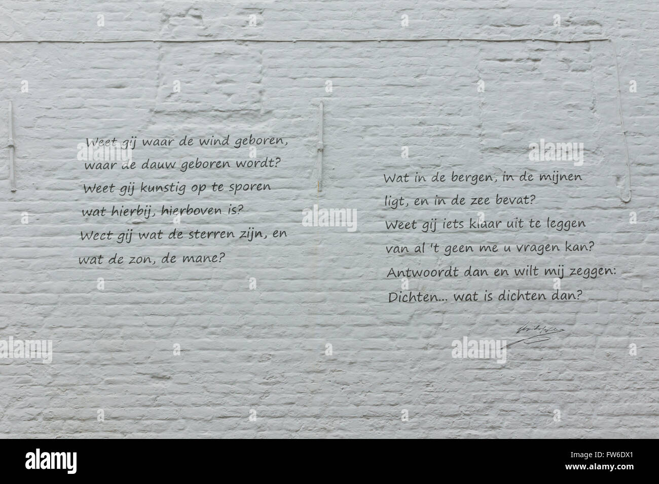 outdoor artwork on a painted white brick wall Stock Photo Alamy