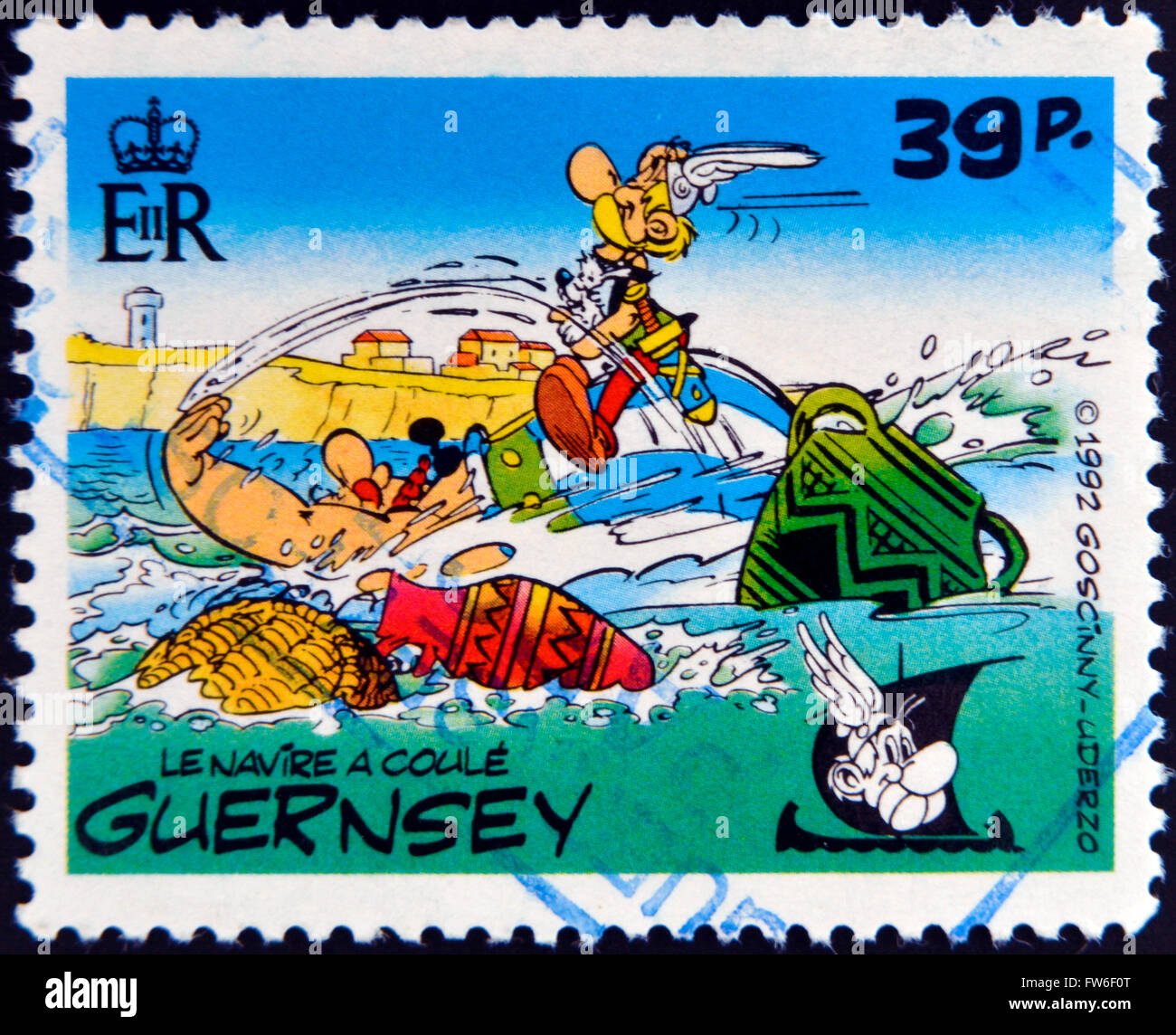 GUERNSEY - CIRCA 1992 : stamp printed in Guernsey shows the ship sinks, belonging to the comic Asterix and Obelix, circa 1992 Stock Photo