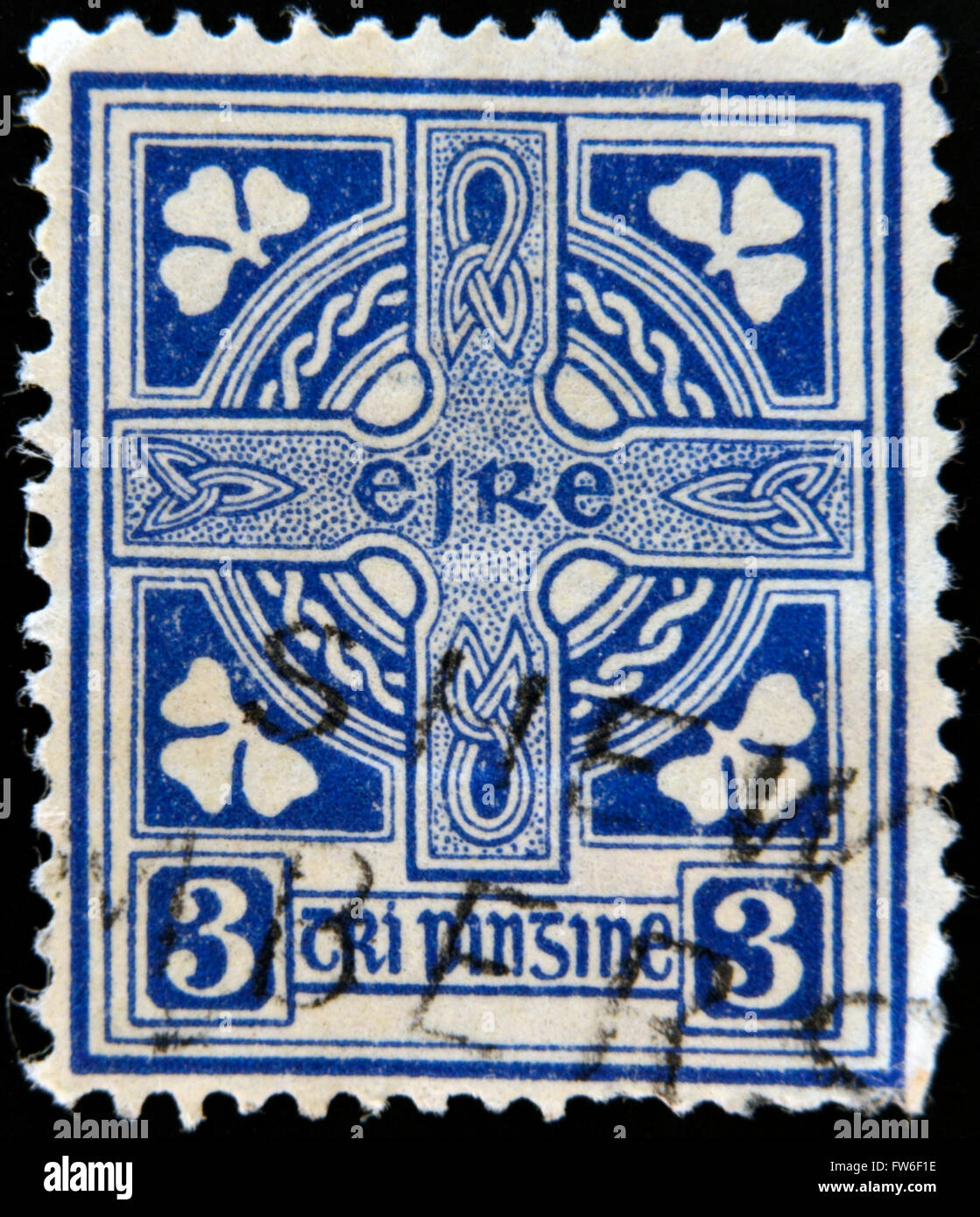 IRELAND-CIRCA 1922: A stamp printed in Ireland shows image of Celtic cross is a symbol that combines a cross with a ring surroun Stock Photo