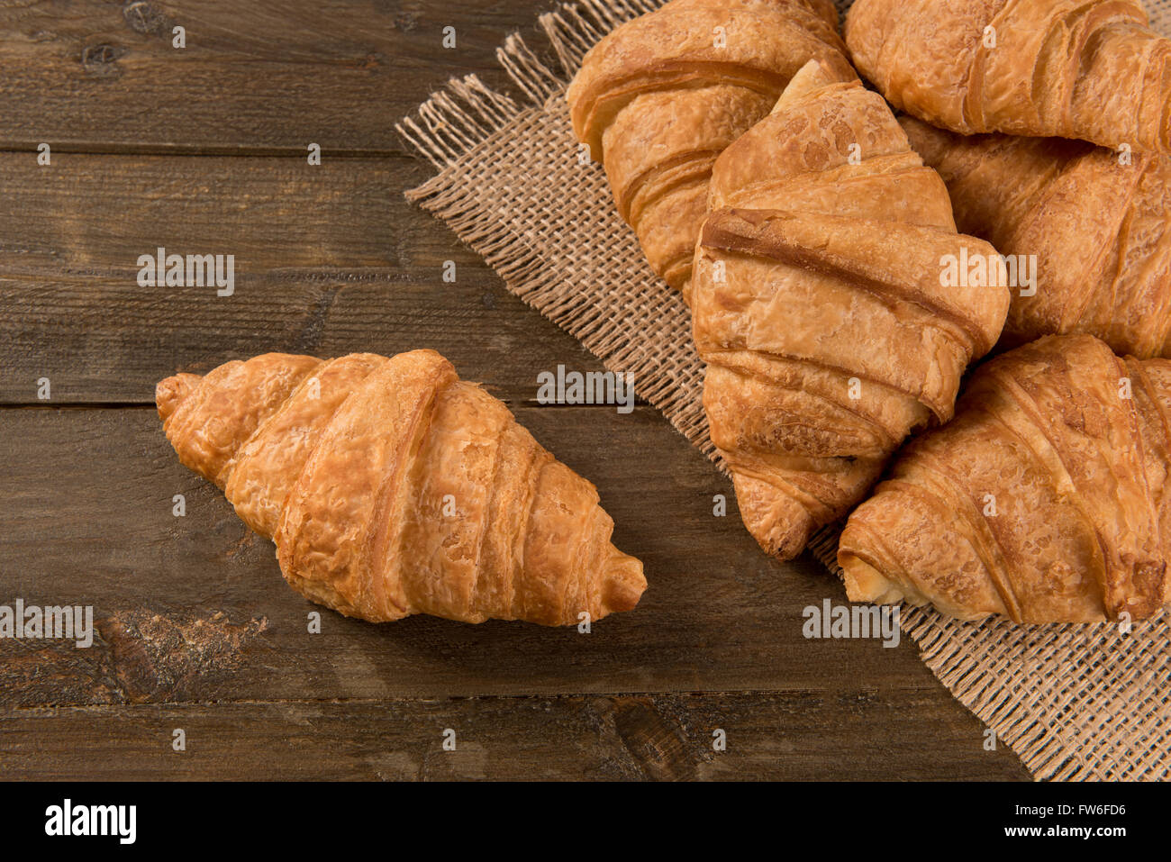 Breakfast croissant on a rustic background Stock Photo