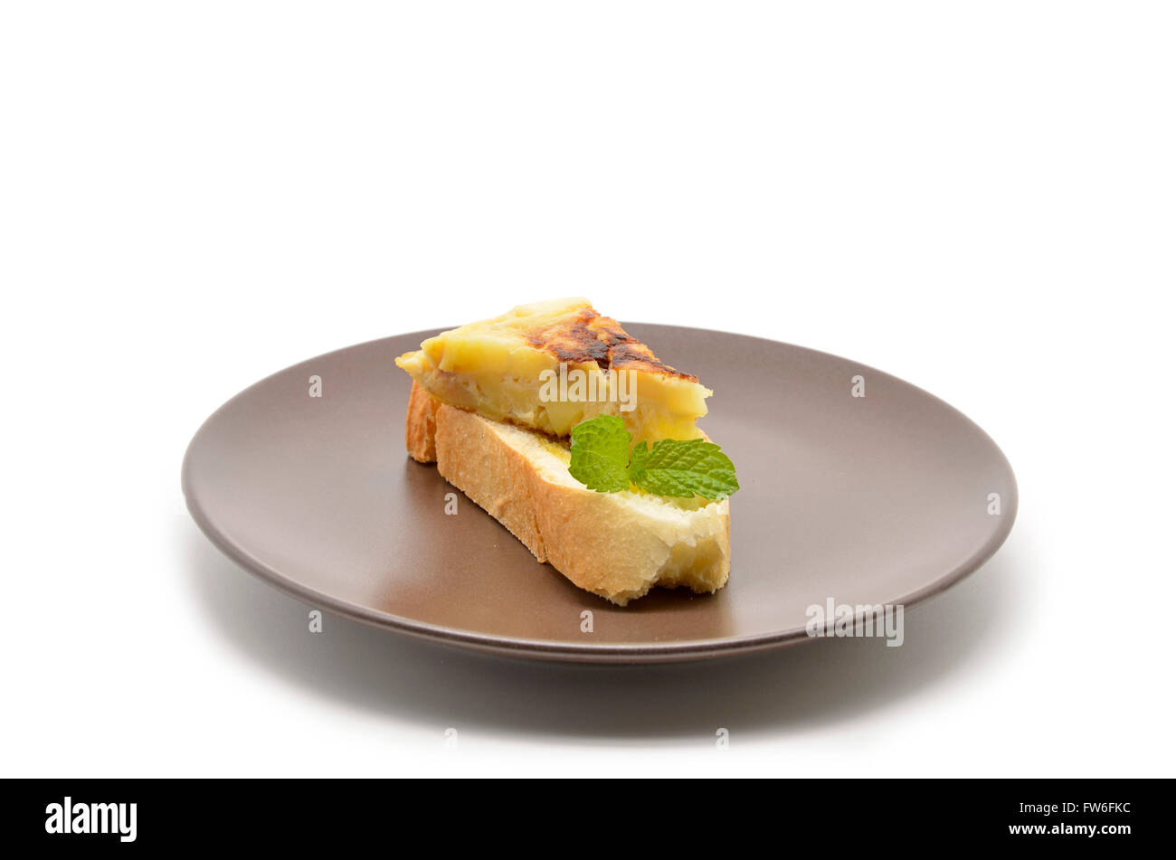 Spanish tortilla (omelet with potatoes and onions) on a slice of bread Stock Photo