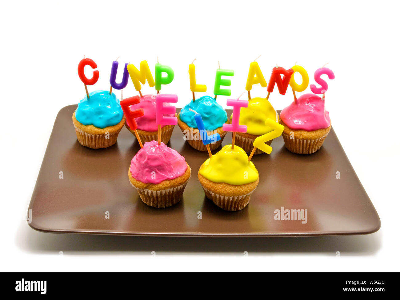 Birthday Cupcakes With Candles Happy Birthday In Spanish Stock Photo Birthday Cupcakes With Candles Happy Birthday In Spanish Stock Photo