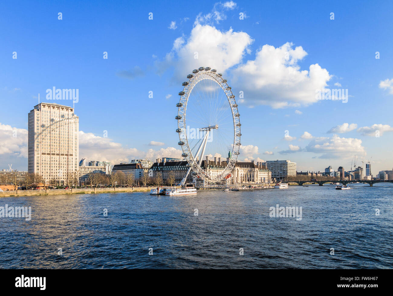 County Hall and the London Eye casting its shadow on the Shell Building ...
