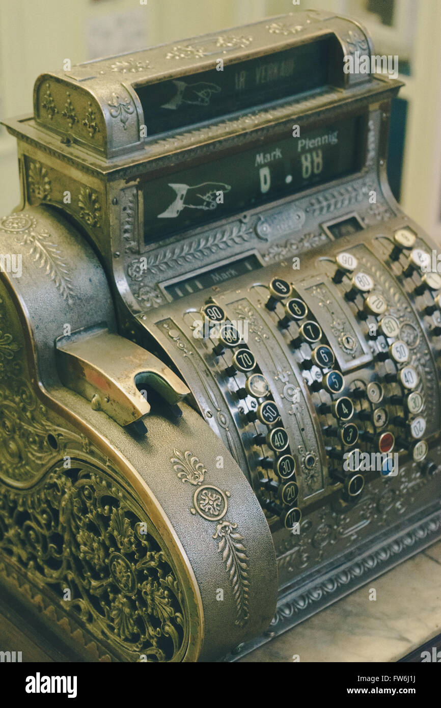 Retro style cash register, vintage toned image Stock Photo