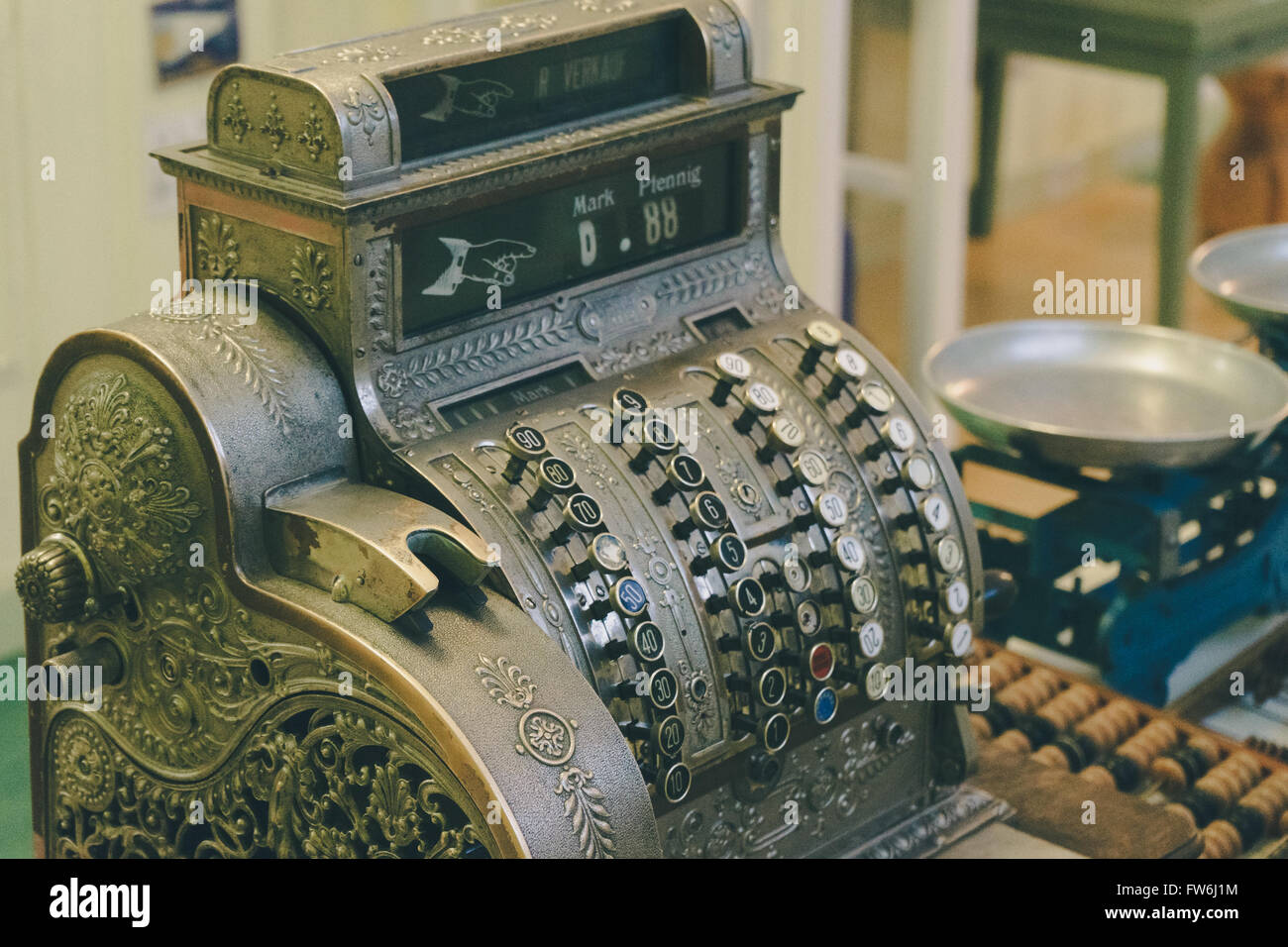 Retro style checkout machine, vintage toned image Stock Photo