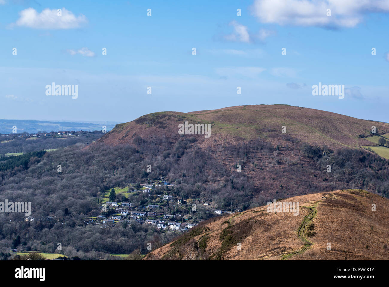 A village nestles below a mountain in a South Wales valley. Stock Photo