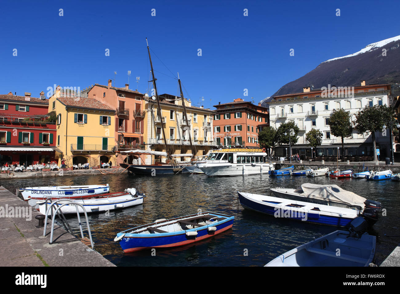 View of Malcesine town center and small port. Malcesine is located on the eastern shore of Lake Garda in the Province of Verona Stock Photo