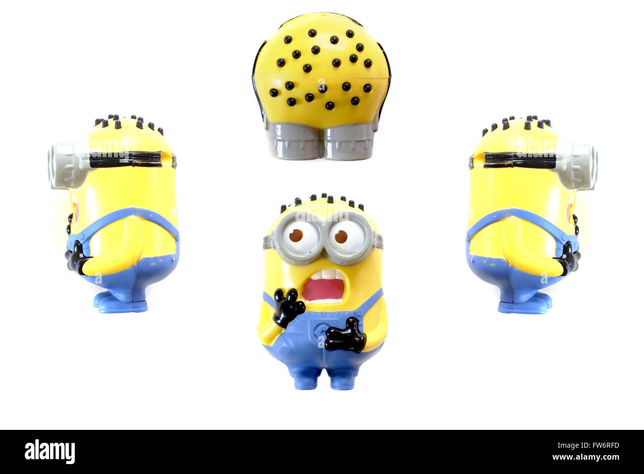 Different views of a Minion toy figure from the Despicable Me film photographed against a white background. Stock Photo