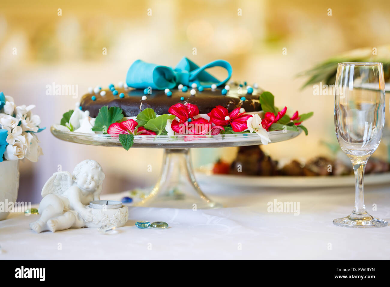 Wedding Chocolate Cake Decorated With Stuff On A White Table Stock