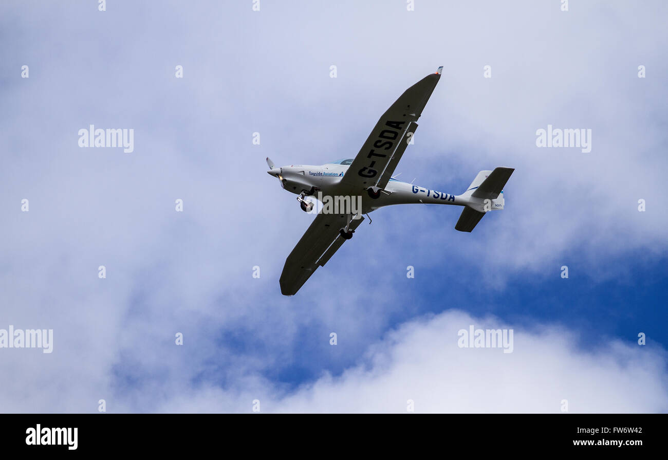 Tayside Aviation 'G-TSDA' “Aquila 211” light aircraft flying overhead at the airport in Dundee, UK Stock Photo