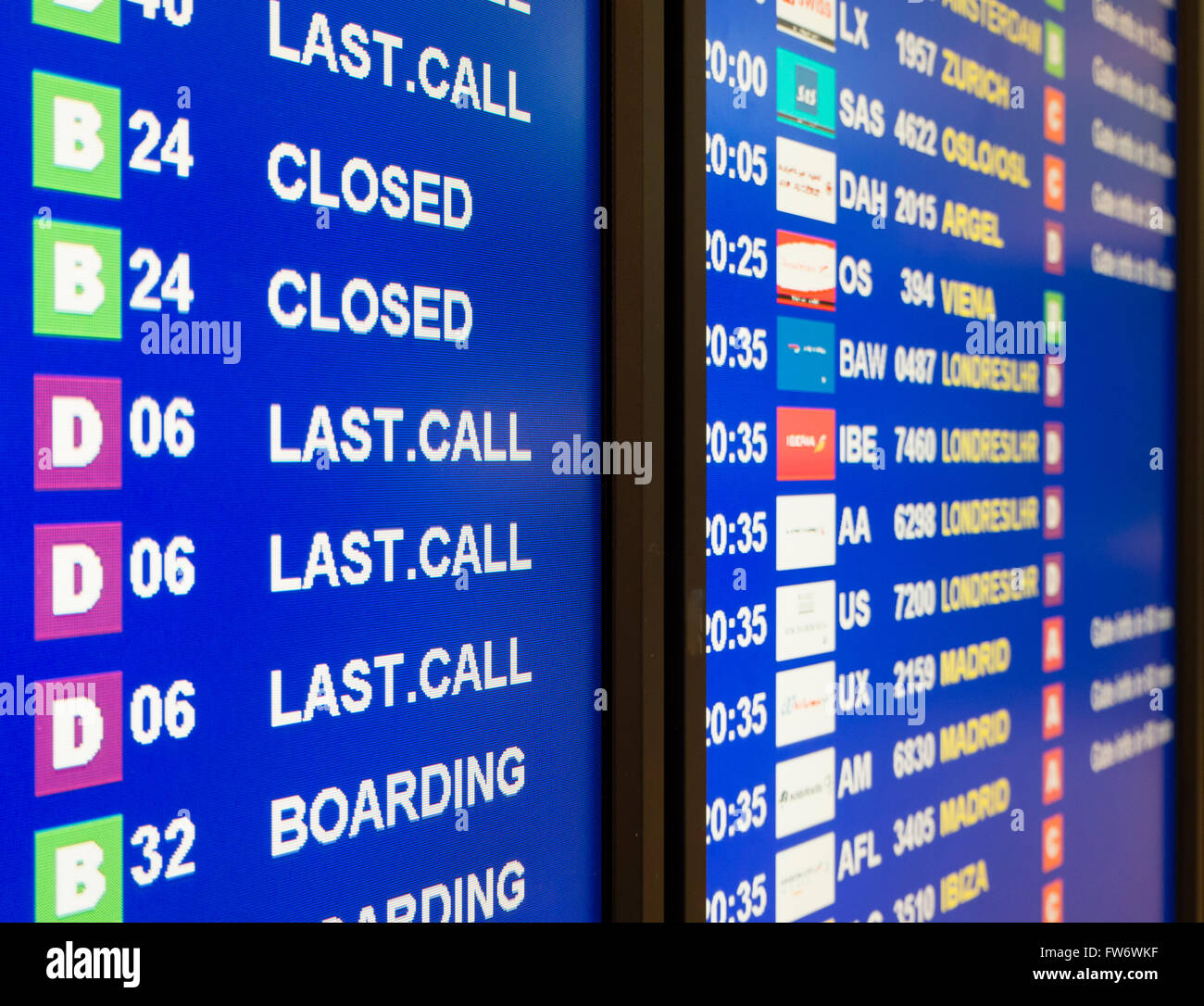 Electronic annunciator panel at an airport showing 'Last Call' and boarding announcements Stock Photo