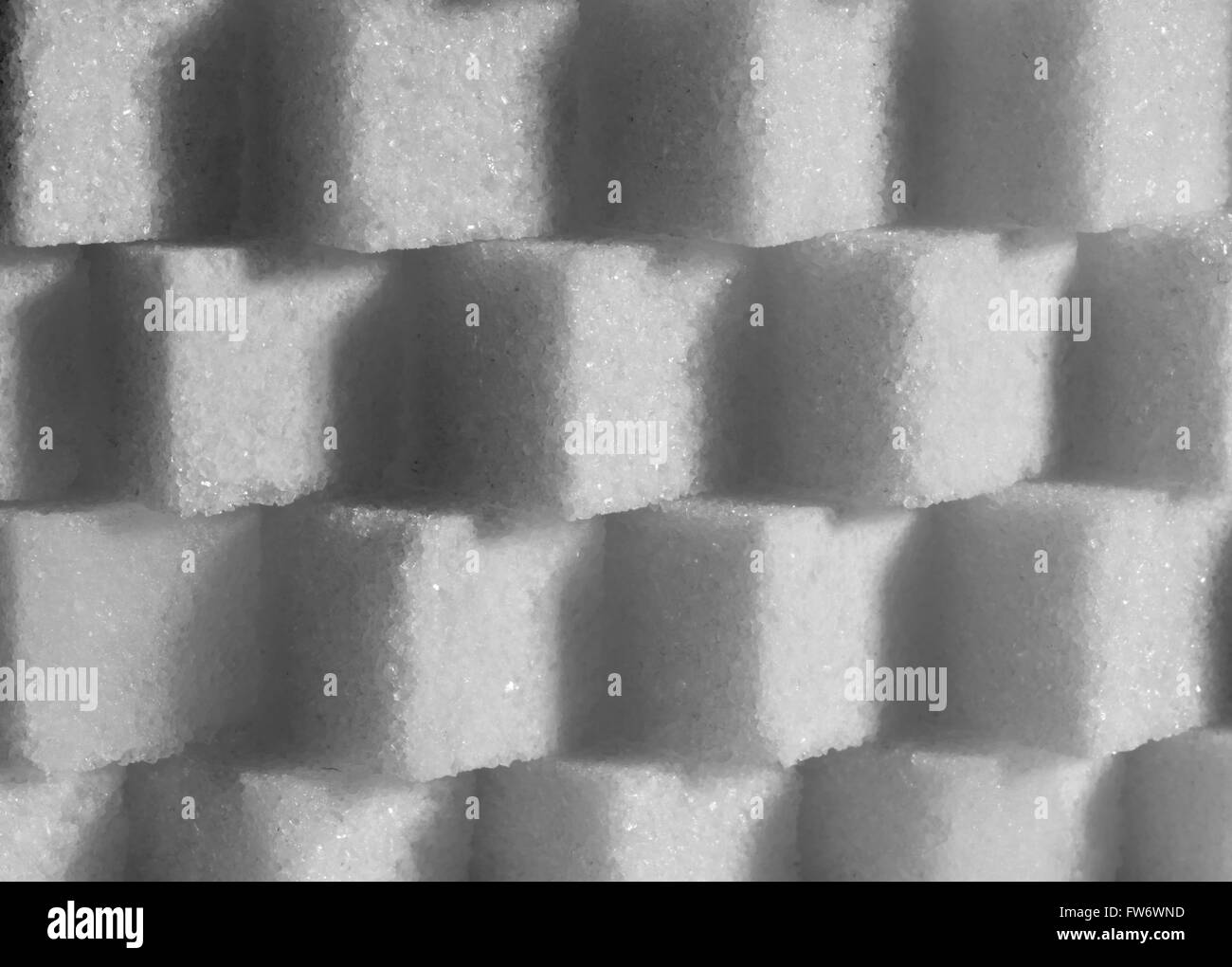 Sugar cubes stacked to form a lattice wall Stock Photo
