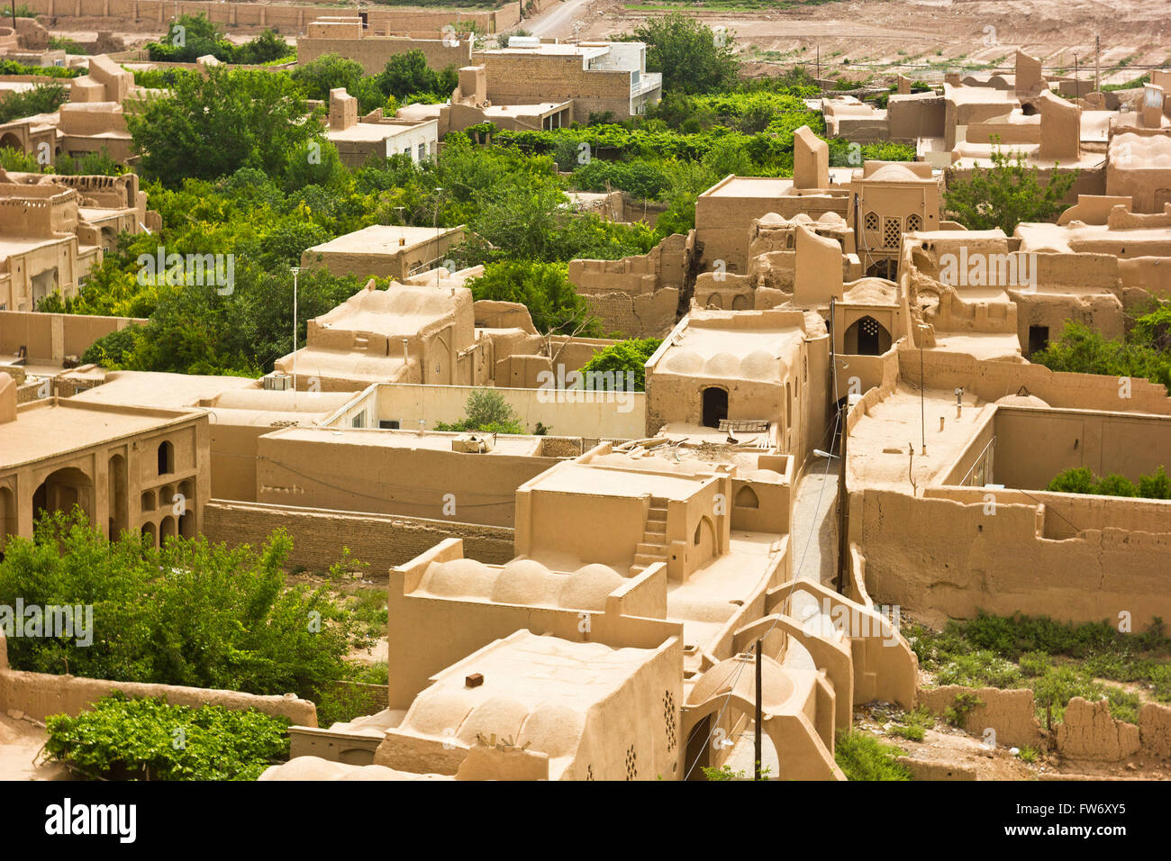 old oasis with sand buildings and trees in Yazd province, iran Stock