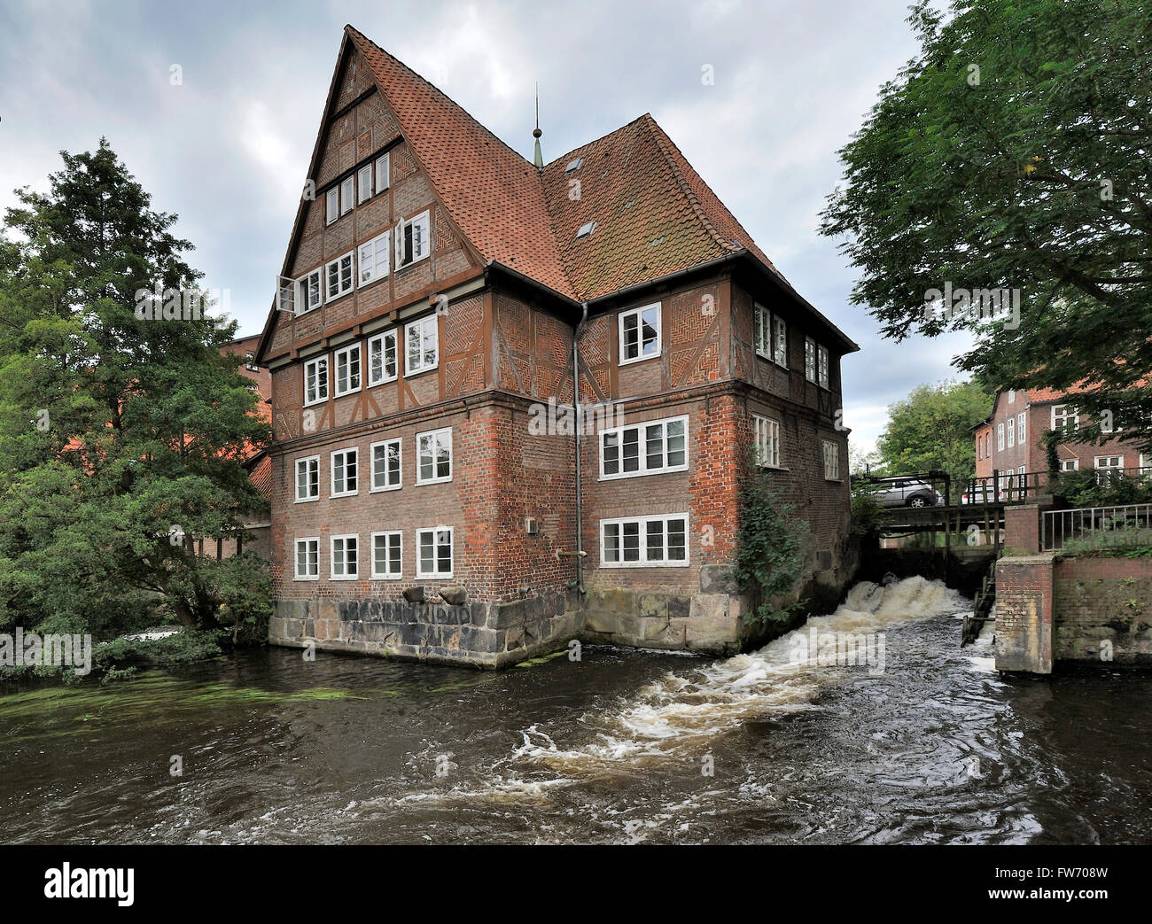 Ratsmuhle building on Ilmenau river, Luneburg, Germany Stock Photo