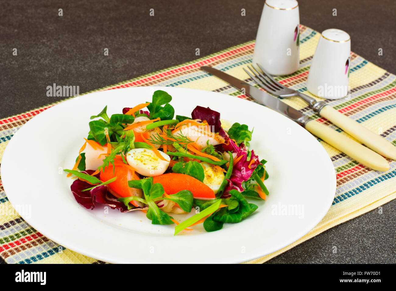 Frise Corn Salad with Chicory, Escarole, Crab Sticks and Quail E Stock Photo