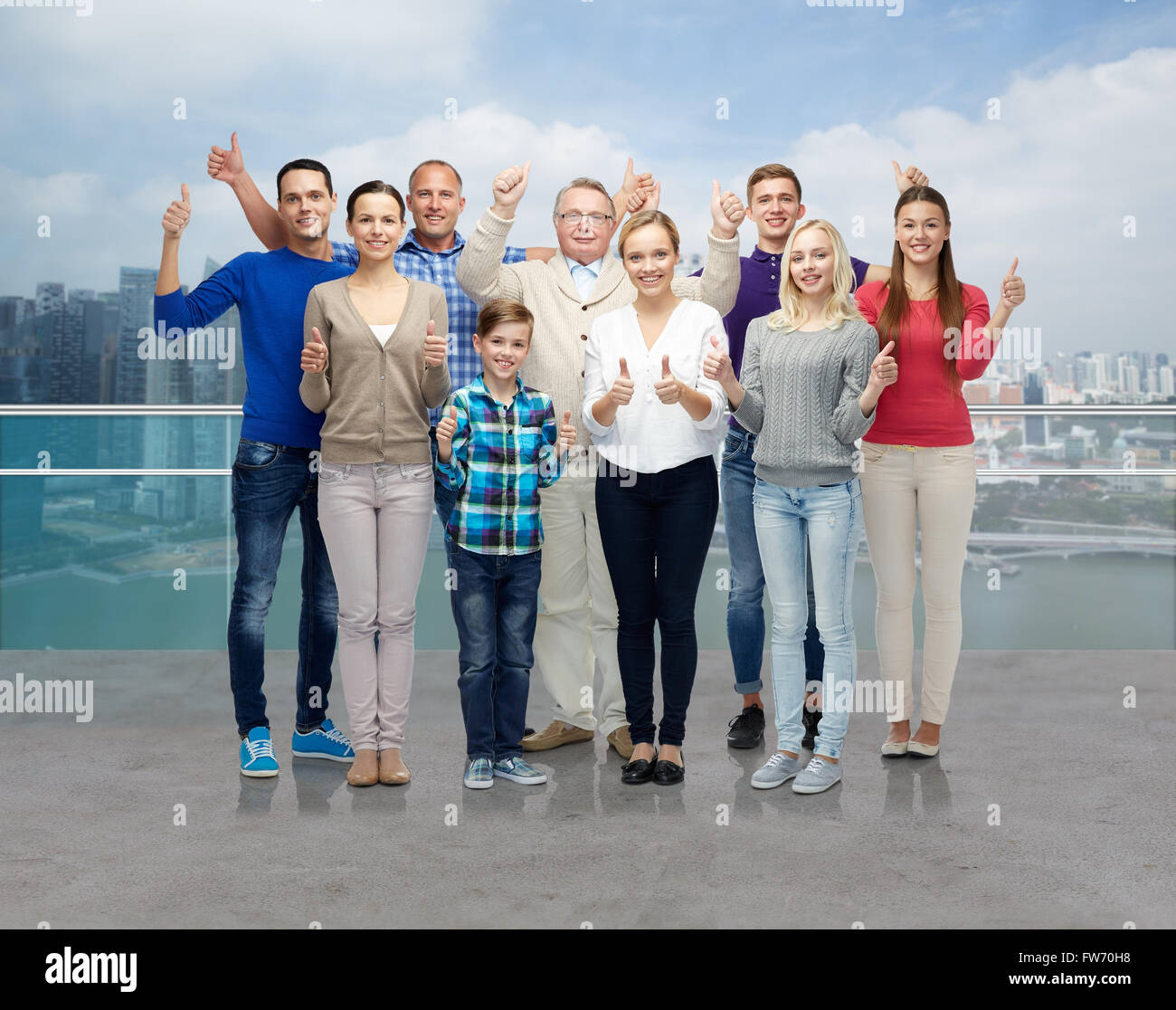 group of smiling people showing thumbs up Stock Photo - Alamy