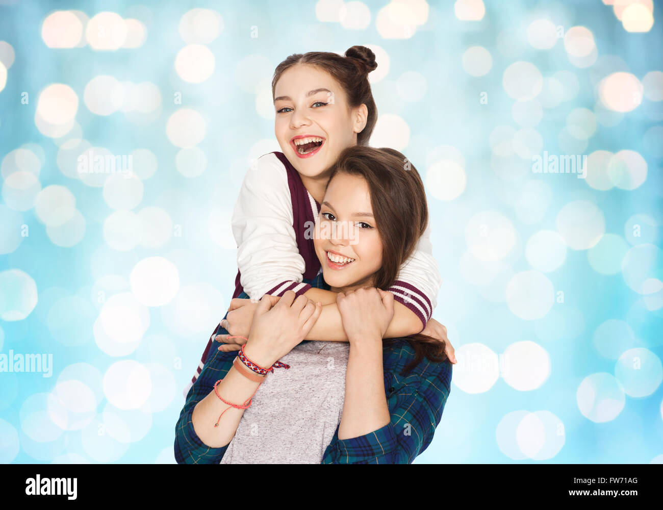 happy smiling pretty teenage girls hugging Stock Photo - Alamy