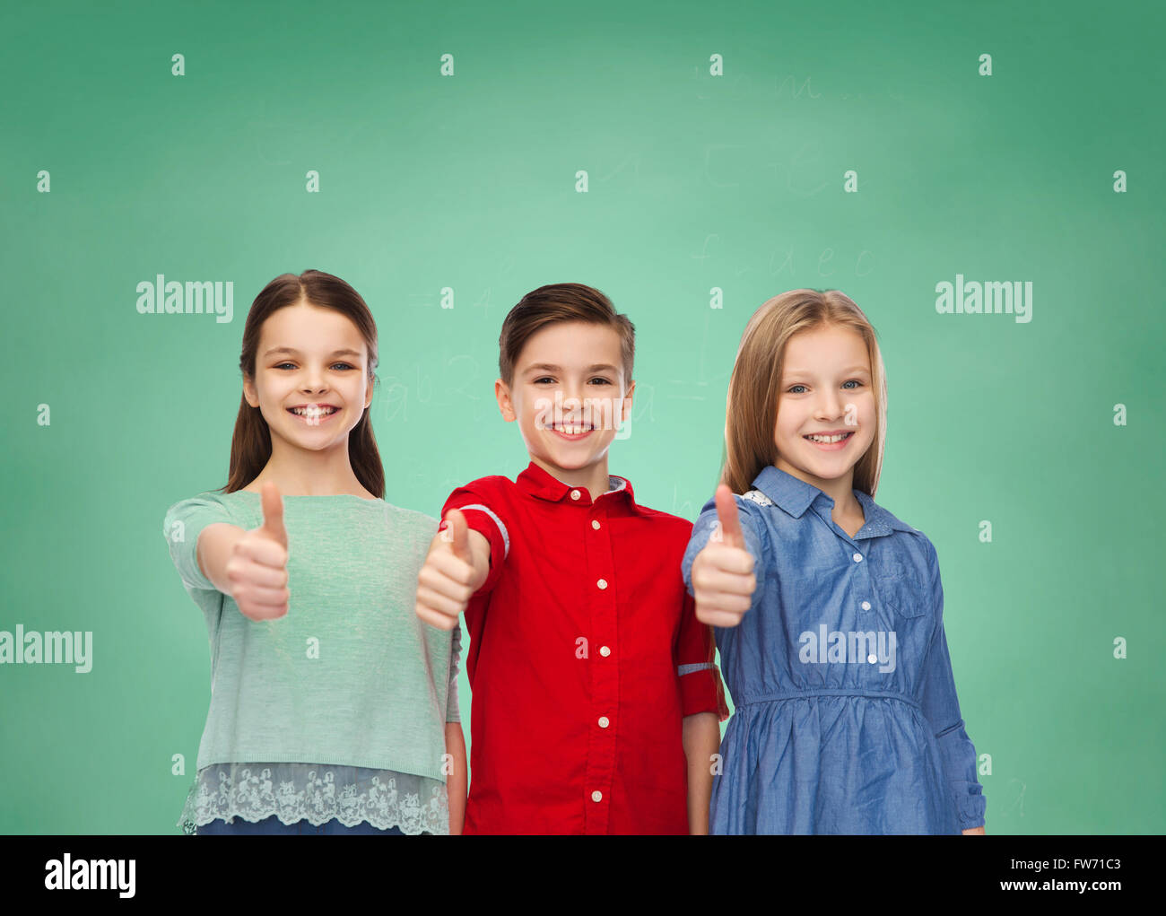 happy children showing thumbs up over green board Stock Photo - Alamy