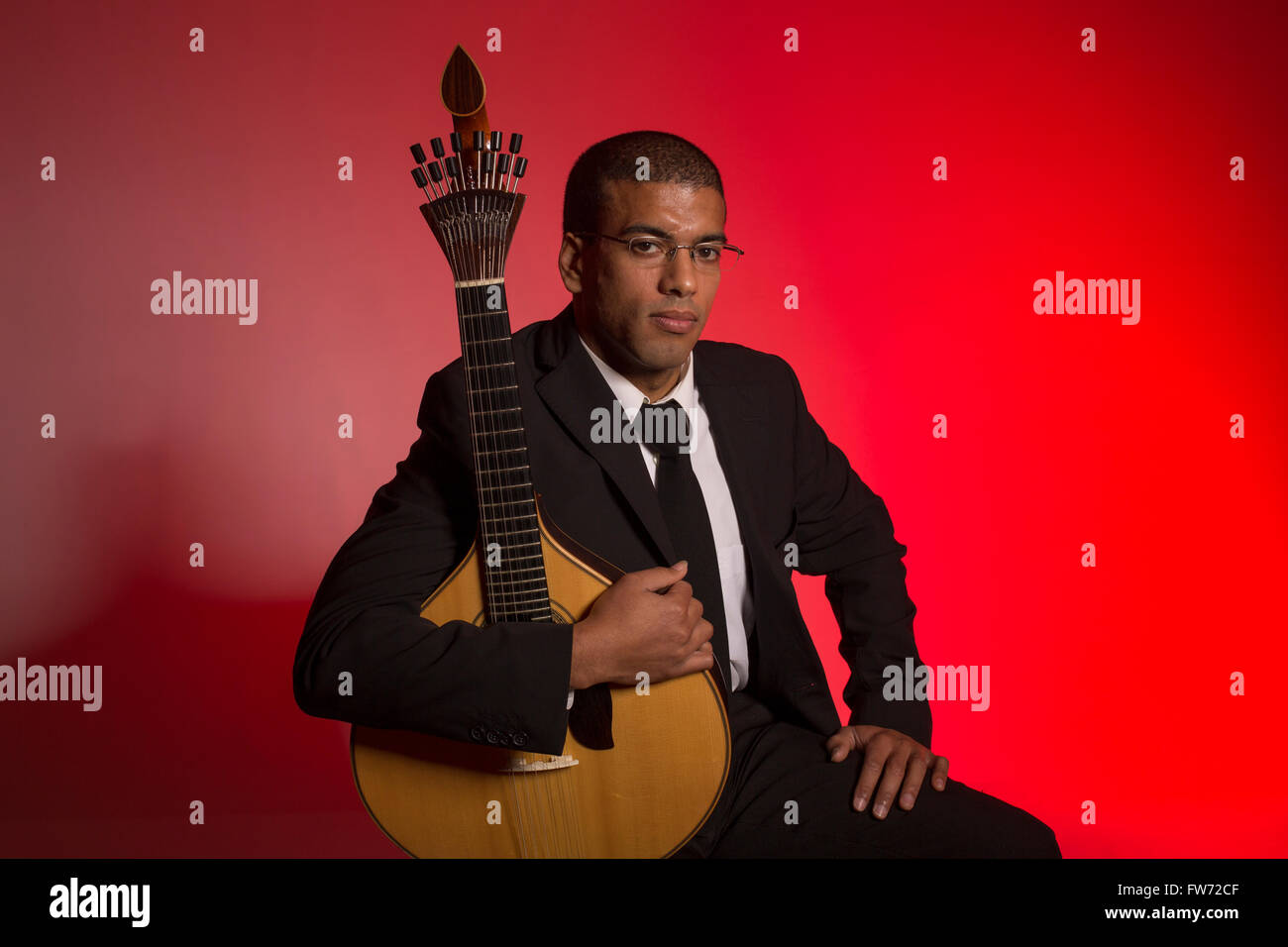 fado musician with a portuguese guitar, studio Stock Photo