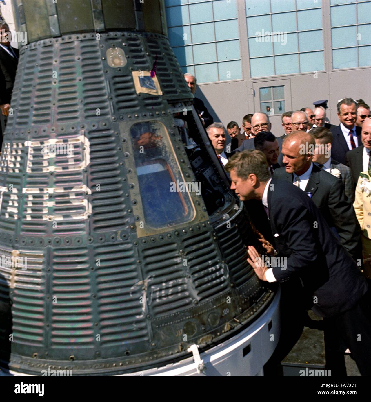 U.S. President John F. Kennedy and Astronaut John Glenn look into the Mercury Friendship 7 space capsule that carried Glenn into space at the Cape Canaveral Air Force Base February 23, 1962 in Cocoa Beach, Florida. Glenn was awarded Distinguished Service Medal by the President following his historic flight. Those looking on include: Special Assistant to the President Lawrence Larry O'Brien; Senator George Smathers of Florida; Director of the Manned Spacecraft Center Dr. Robert Gilruth.  Please credit 'Cecil Stoughton, White House/John F. Kennedy Presidential Library and Museum, Boston' Stock Photo