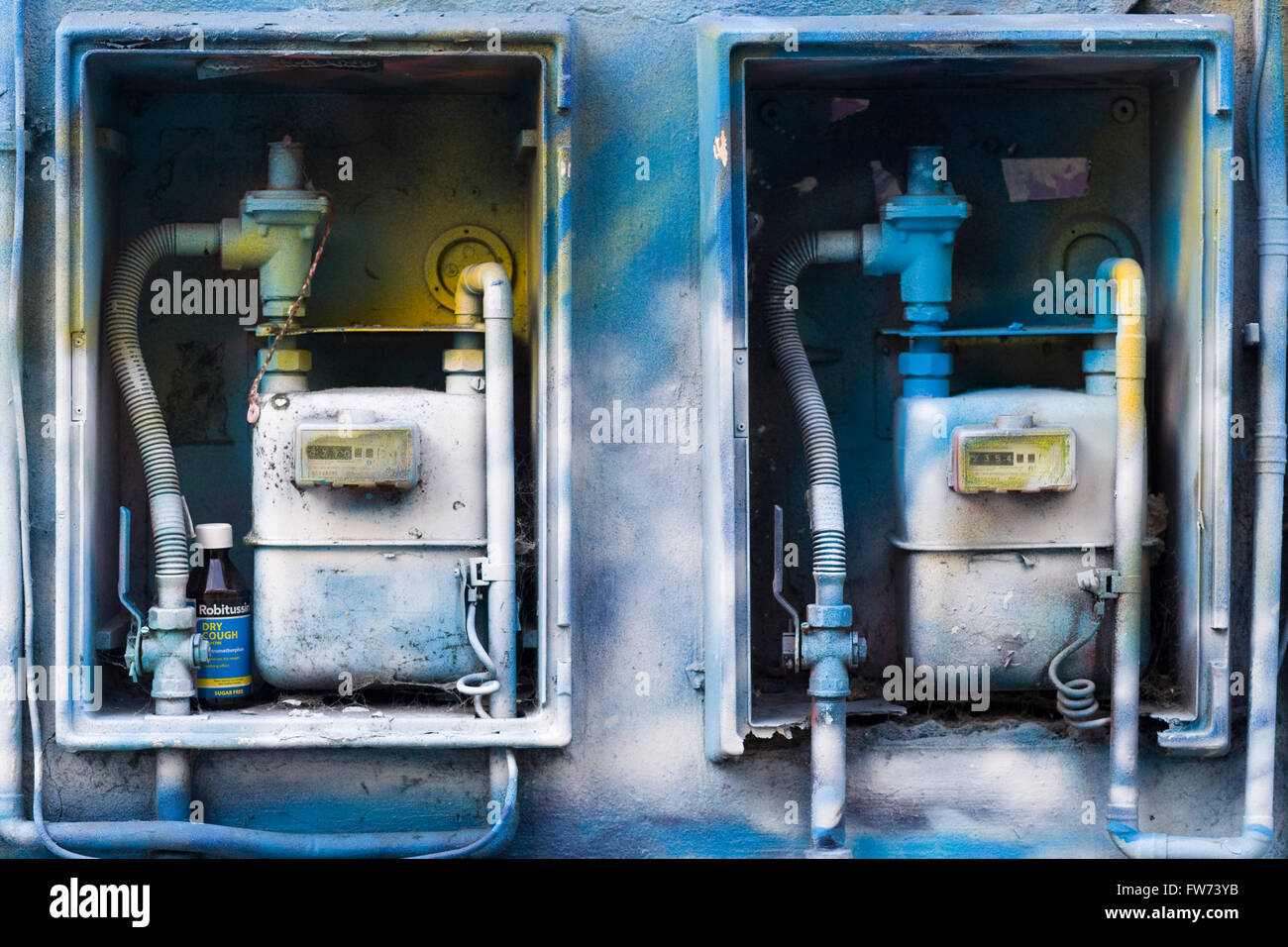 electrical meter and gas boxes spray painted with Graffiti Stock Photo