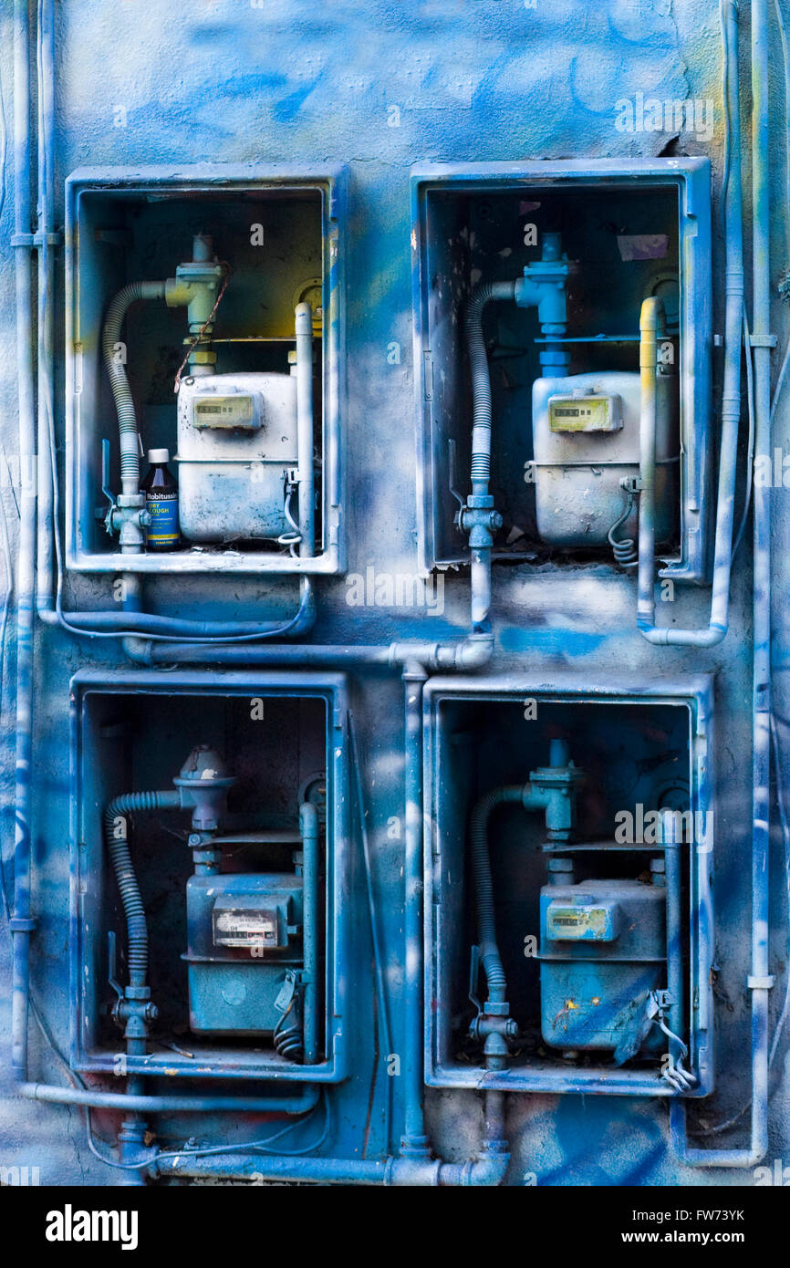 electrical meter and gas boxes spray painted with Graffiti Stock Photo