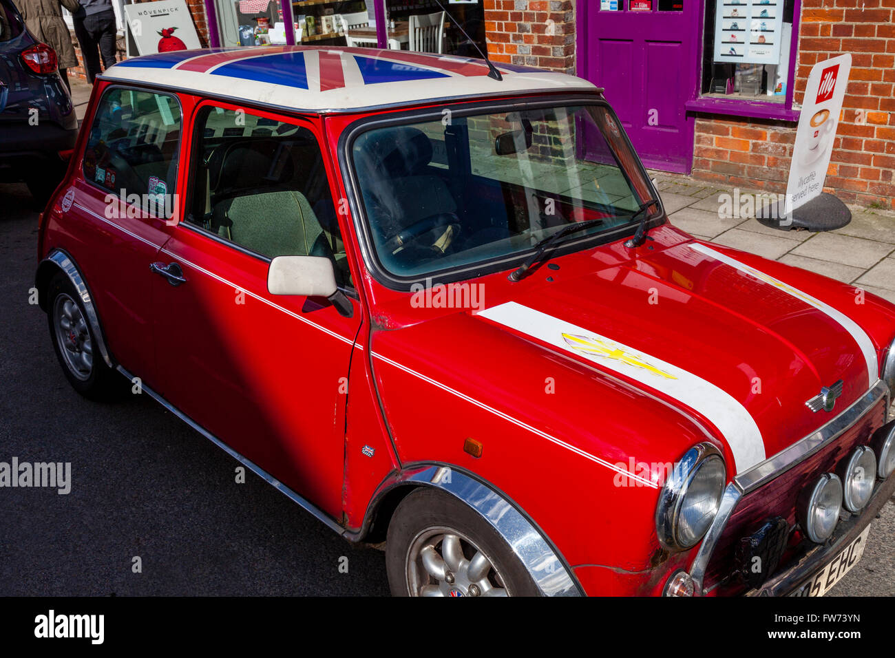A Red Mini Cooper wth a Union Jack Roof by John Cooper version of