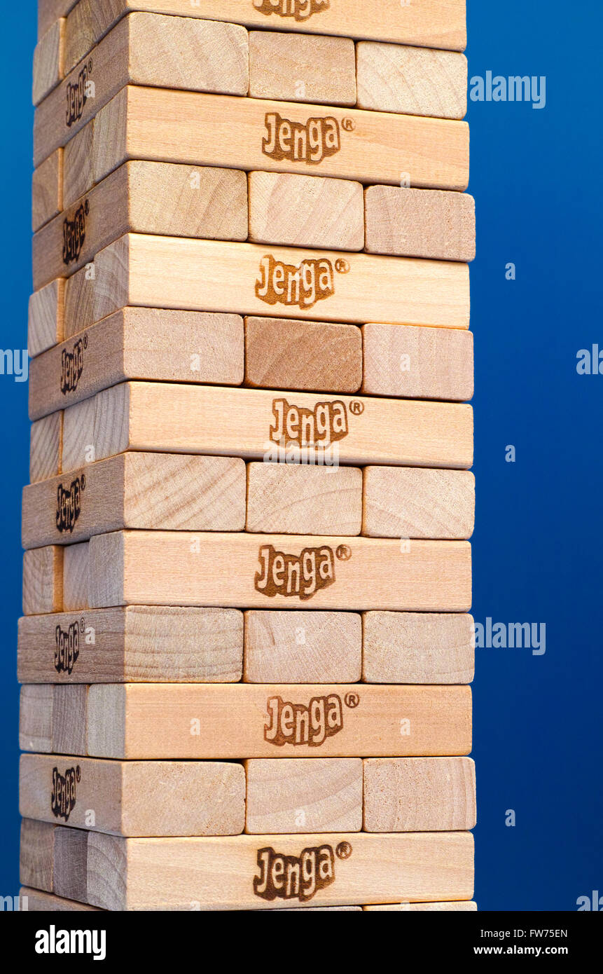 Tambov, Russian Federation - March 03, 2016 Jenga tower constructed with blue background. Studio shot. Stock Photo