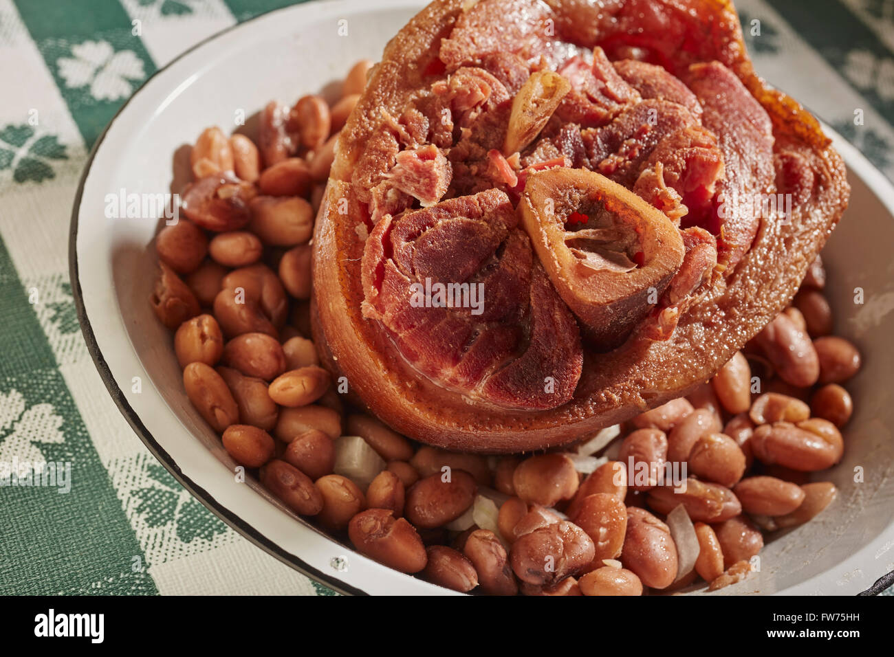 A cooked ham hock with pinto beans, called 'soup beans' in Appalachia, USA Stock Photo