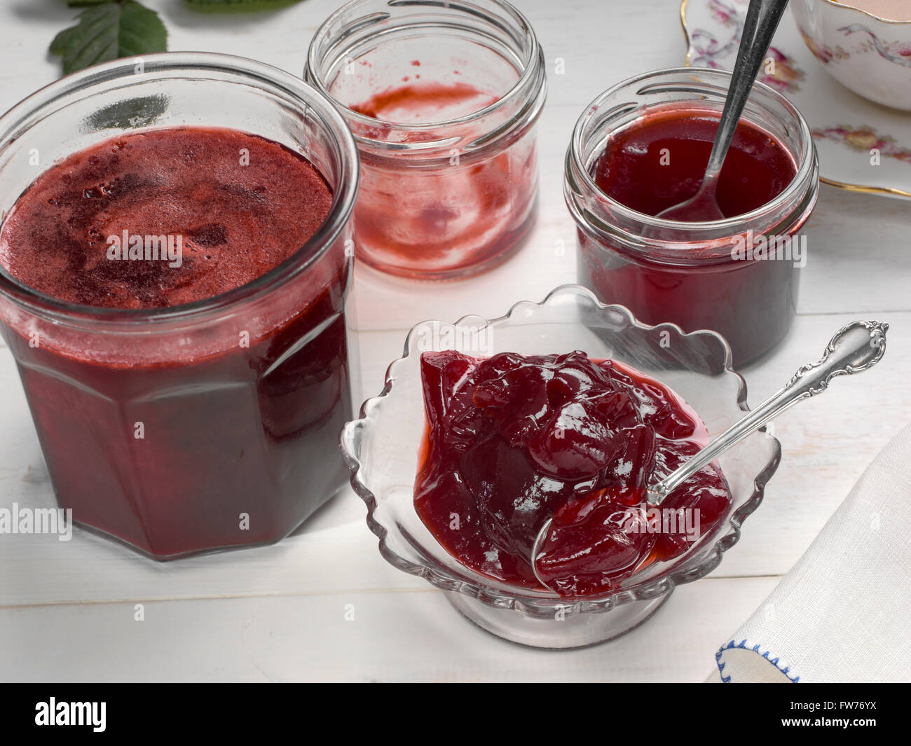 straining fruit that is softened by cooking, through a muslin bag for fruit  jelly making Stock Photo - Alamy