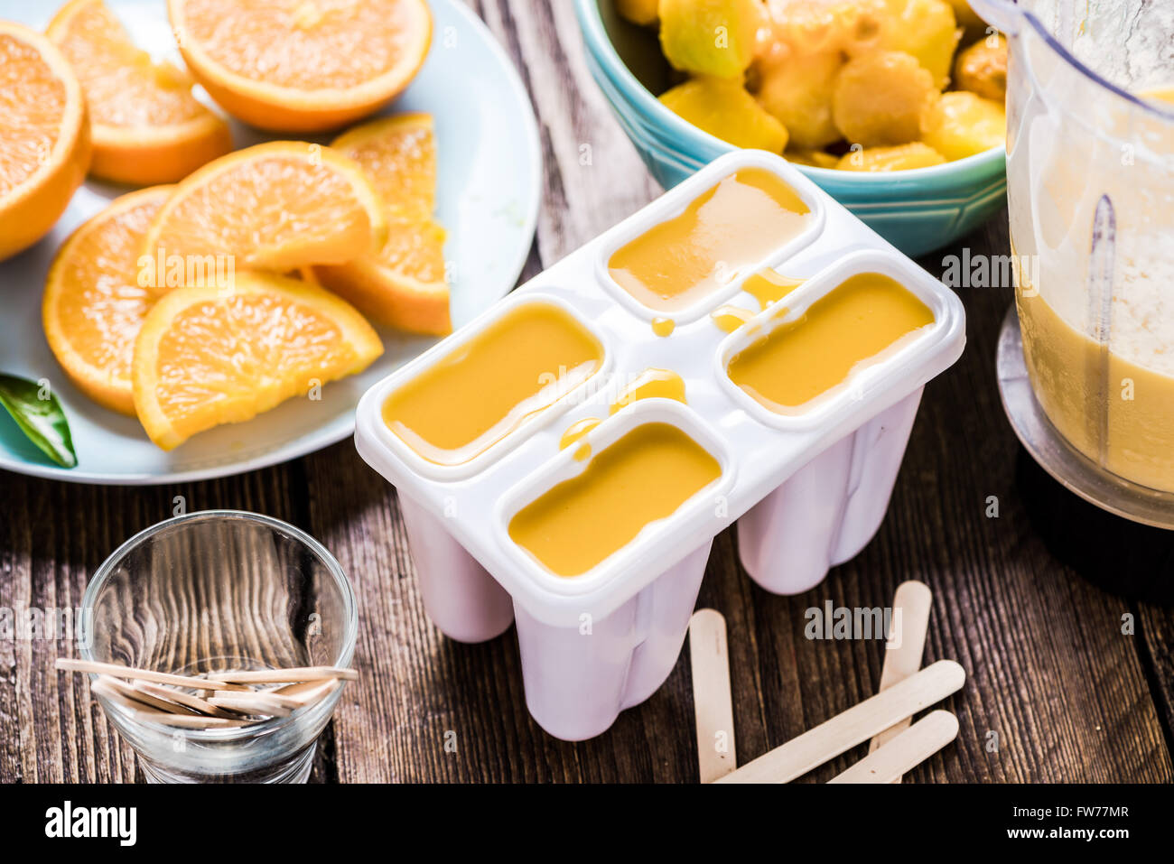 Making popsicle from exotic fruits and juice Stock Photo