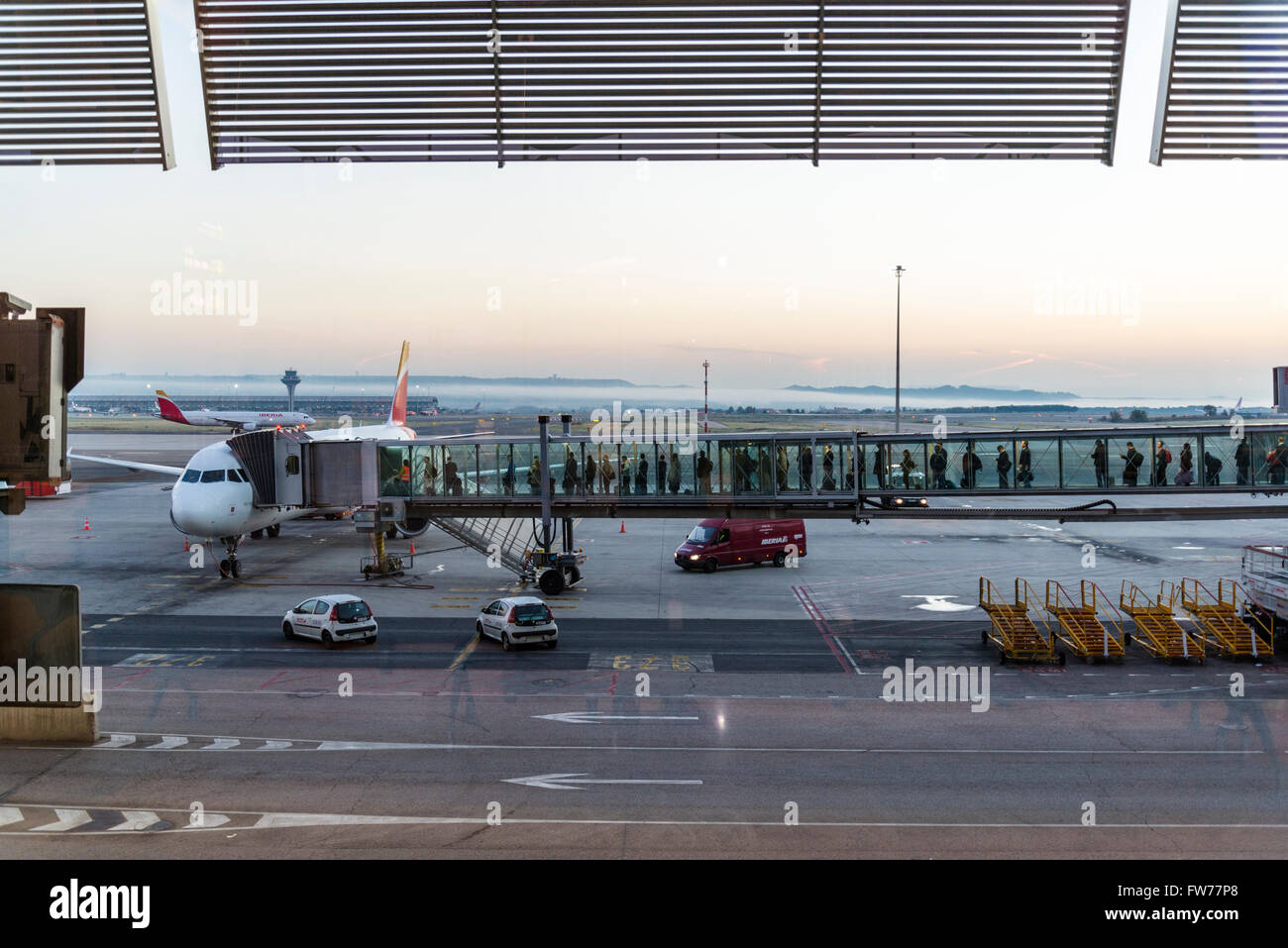 People boarding plane, Barajas Airport, Madrid, Spain Stock Photo