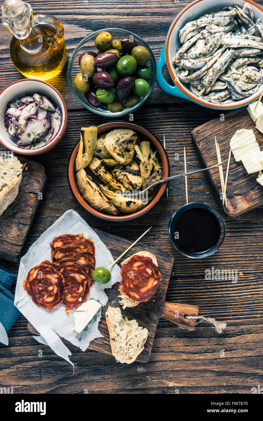 Traditional tapas served for share with friends in restaurant or bar. Stock Photo