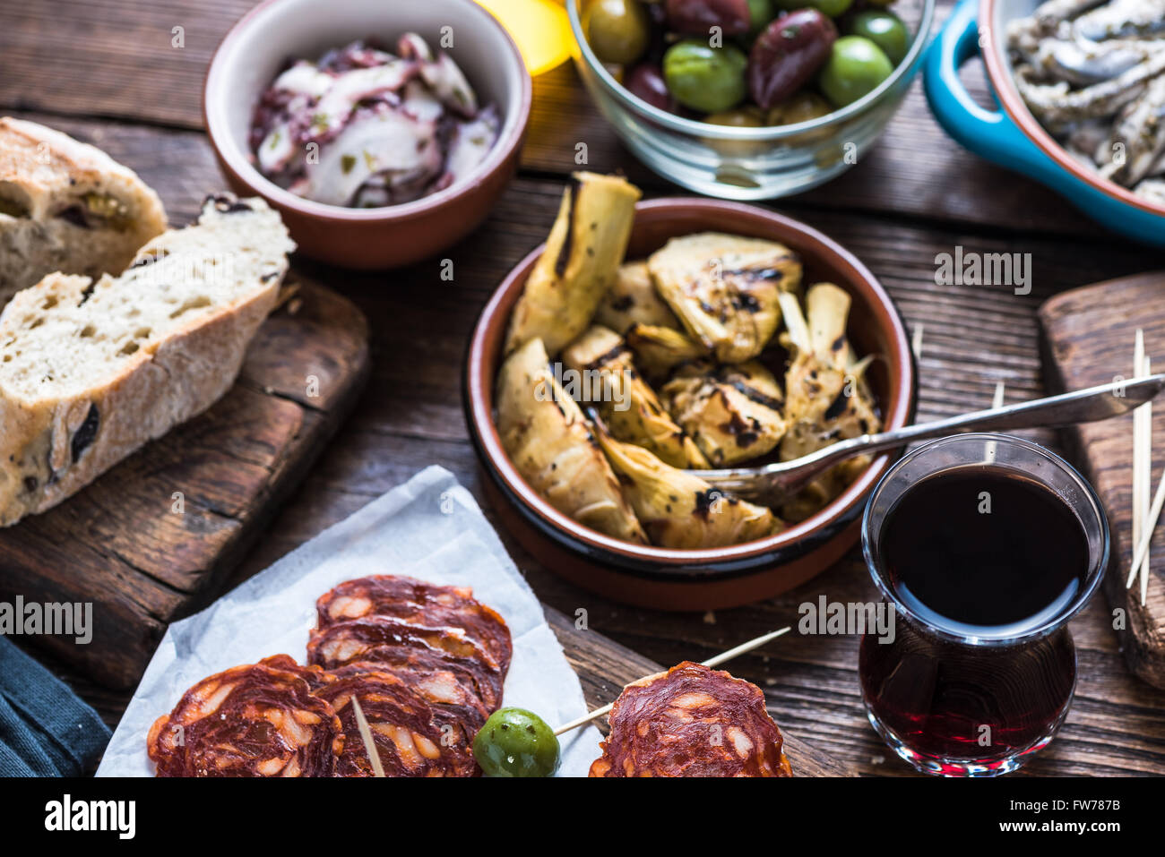 Sharing authentic spanish tapas with friends in restaurant or bar. View