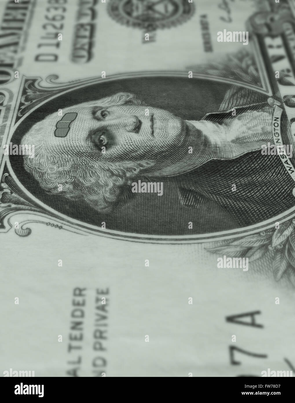 George Washington on a dollar bill is sporting a black eye and a band