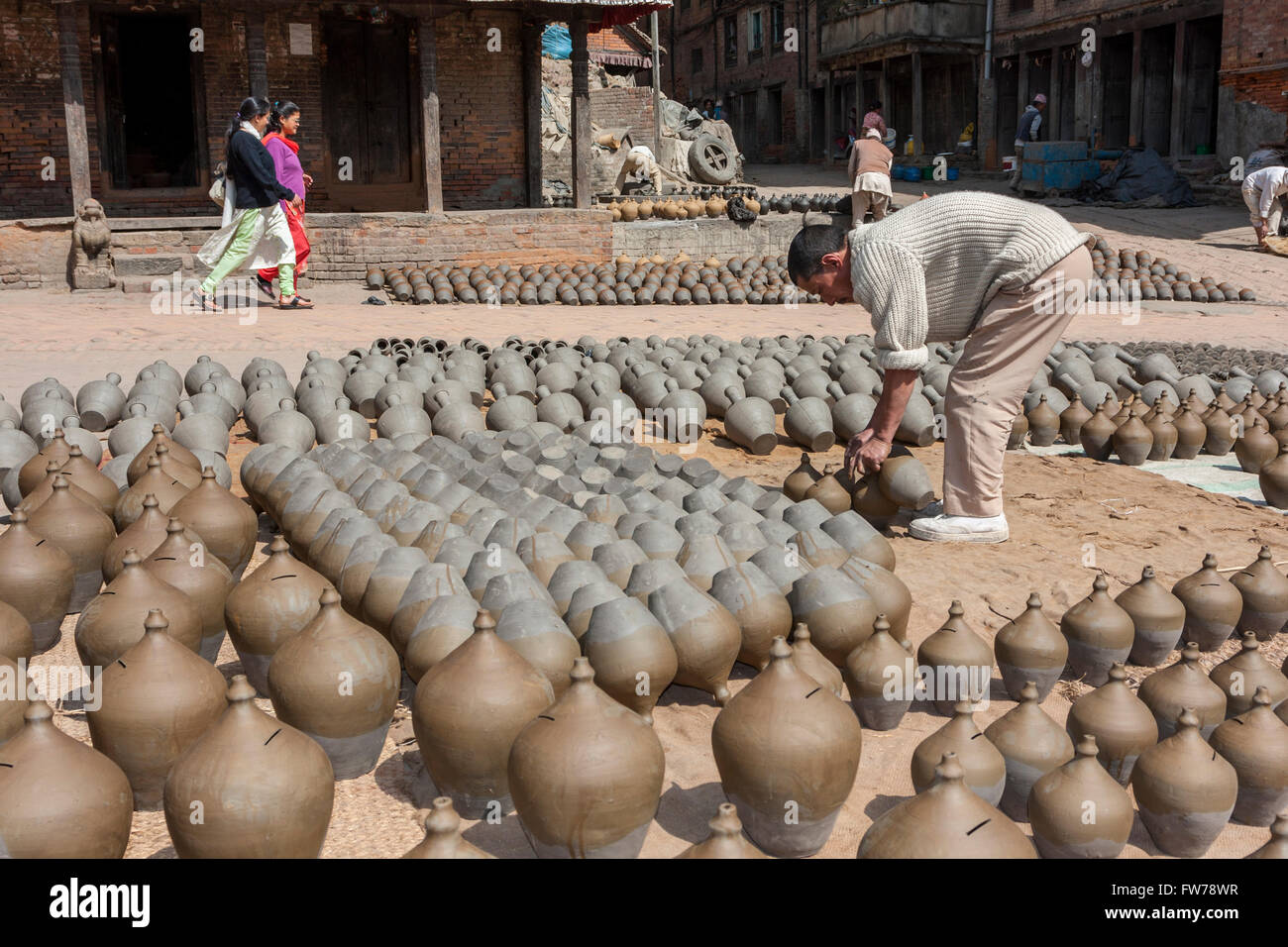 Bhaktapur, Nepal.  Potter at Work in Potters' Square. Stock Photo