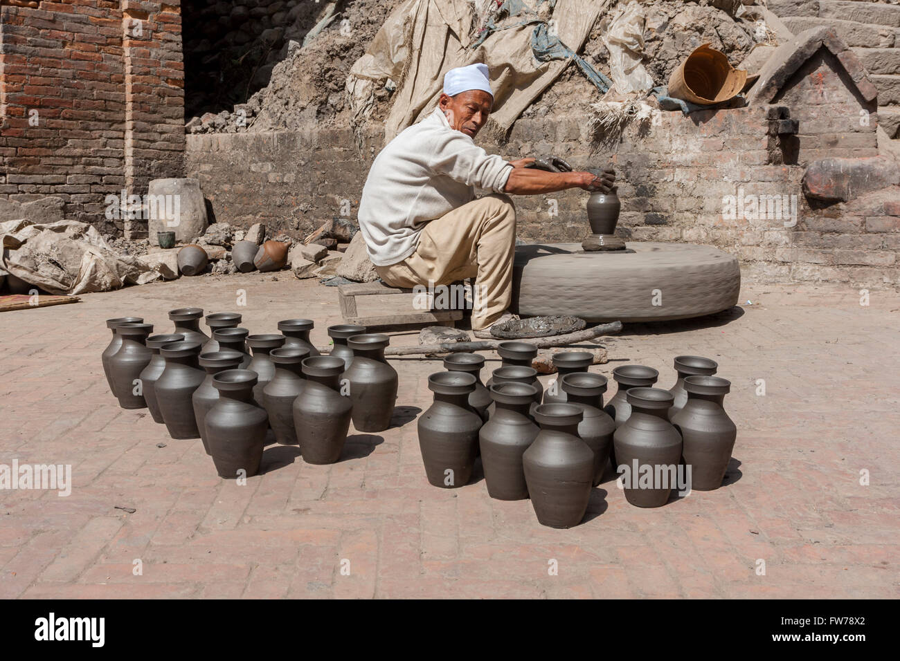 Bhaktapur, Nepal.  Potter Using a Potter's Wheel in Potters' Square. Stock Photo