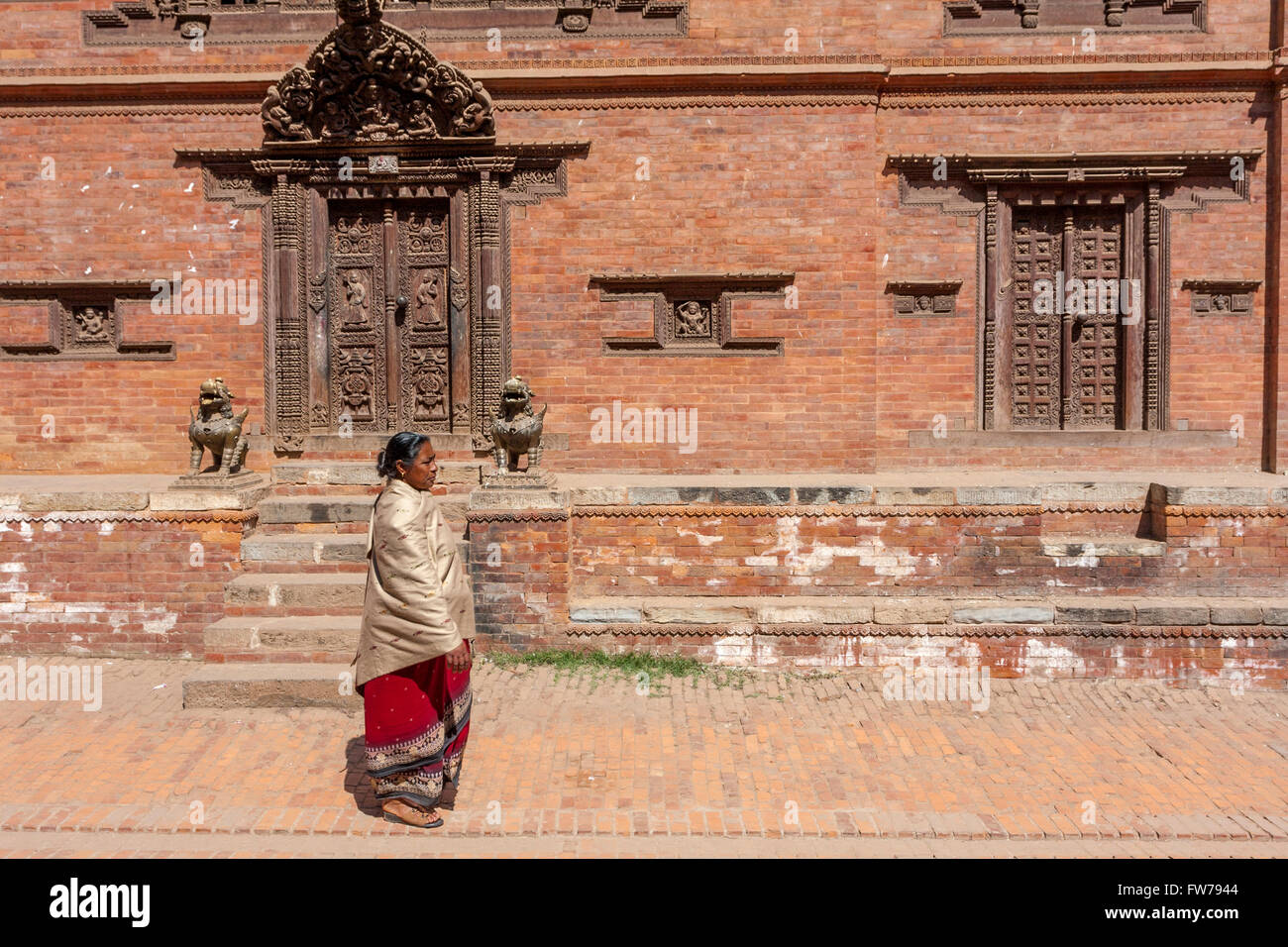 Bhaktapur, Nepal.  Woman Walking Wearing the Traditional Red and Black Worn by Bhaktapur Women. Stock Photo
