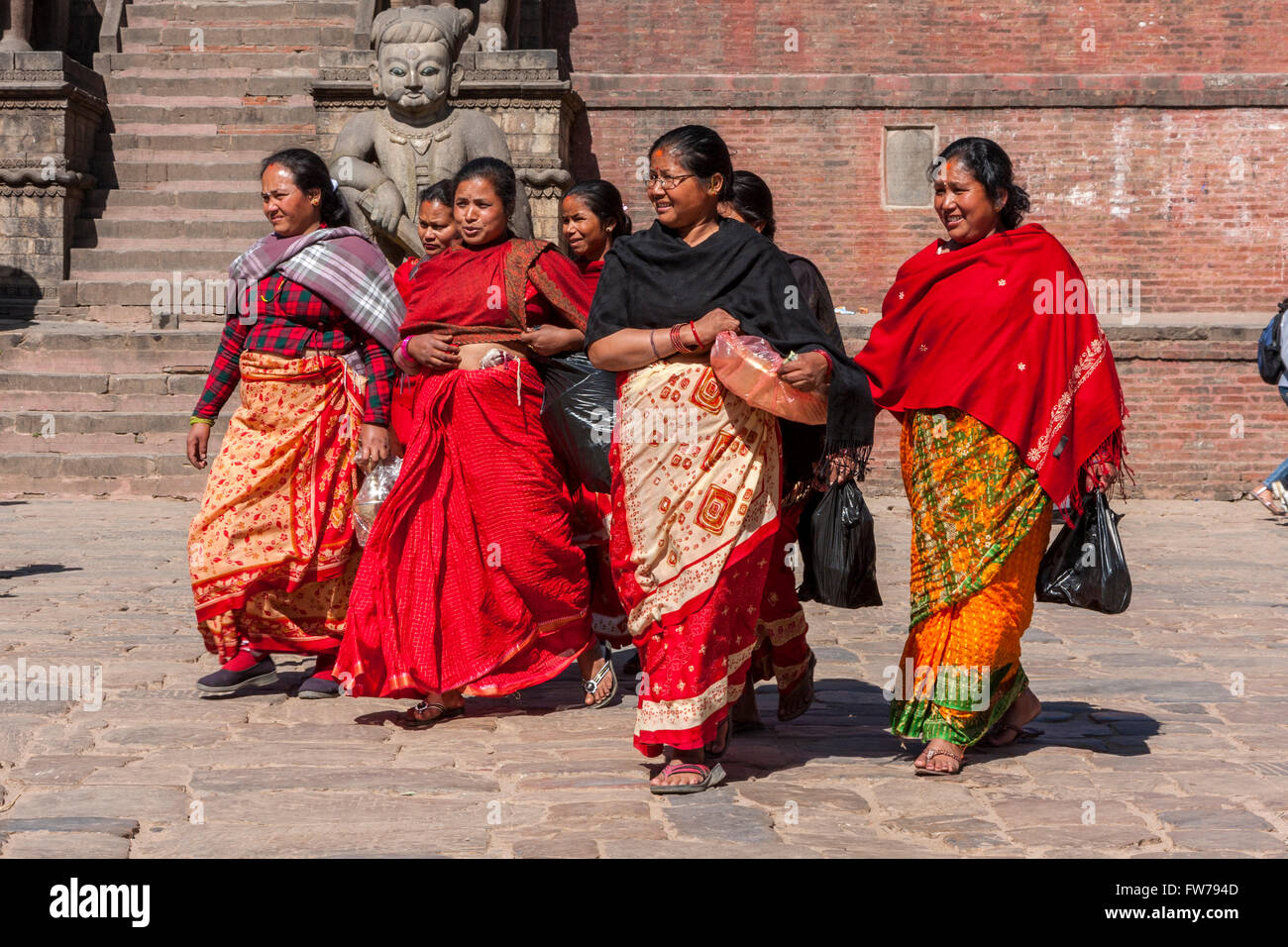 Bhaktapur, Nepal.  Women Walking through Taumadhi Tole Square. Stock Photo